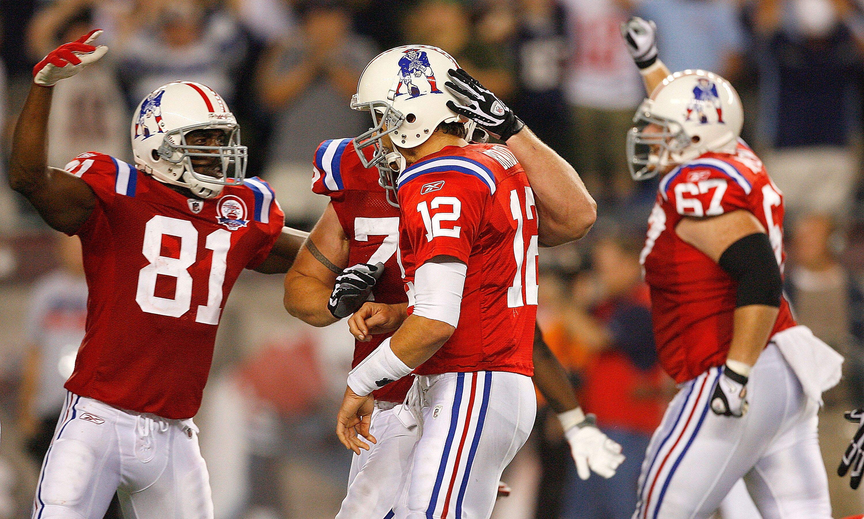 FOXBORO, MA - SEPTEMBER 14:  Tom Brady #12 is congratulated by Randy Moss #81 and Dan Koppen #67 of the New England Patriots after Brady throw a game-winning touchdown pass Benjamin Watson against the Buffalo Bills at Gillette Stadium on September 14, 200