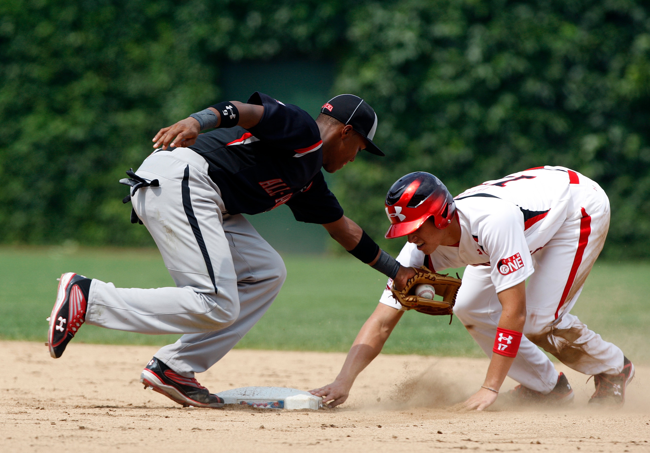 CHICAGO - AUGUST 8:  Yordy Cabrera of the Baseball Factory is late with the tag on Garin Cecchini of Team One after Garin stole second base during the Under Armour All-American Baseball game at Wrigley Field on August 8, 2009 in Chicago, Illinois.  (Photo