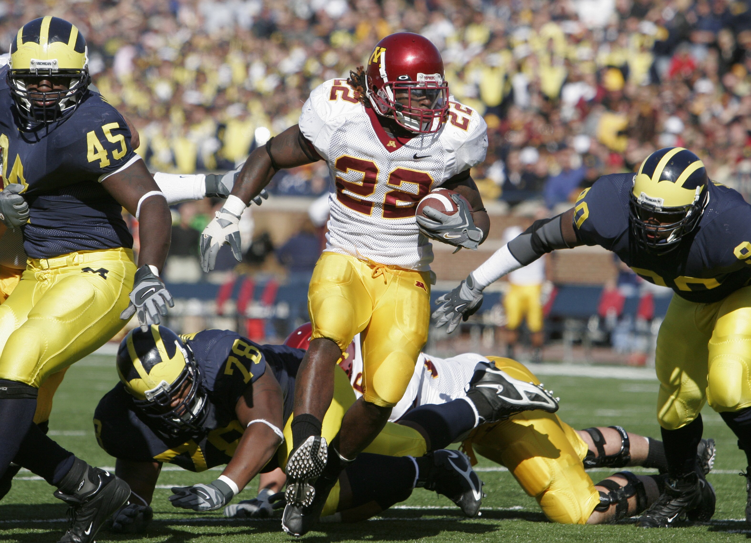 ANN ARBOR - OCTOBER 8: Laurence Maroney #22 of the Minnesota Gophers carries the ball during the game against the Michigan Wolverines at Michigan Stadium on October 8, 2005 in Ann Arbor, Michigan. The pass was incomplete. Minnesota won 23-20. (Photo by ANN ARBOR - OCTOBER 8: Laurence Maroney #22 of the Minnesota Gophers carries the ball during the game against the Michigan Wolverines at Michigan Stadium on October 8, 2005 in Ann Arbor, Michigan. The pass was incomplete. Minnesota won 23-20. (Photo by