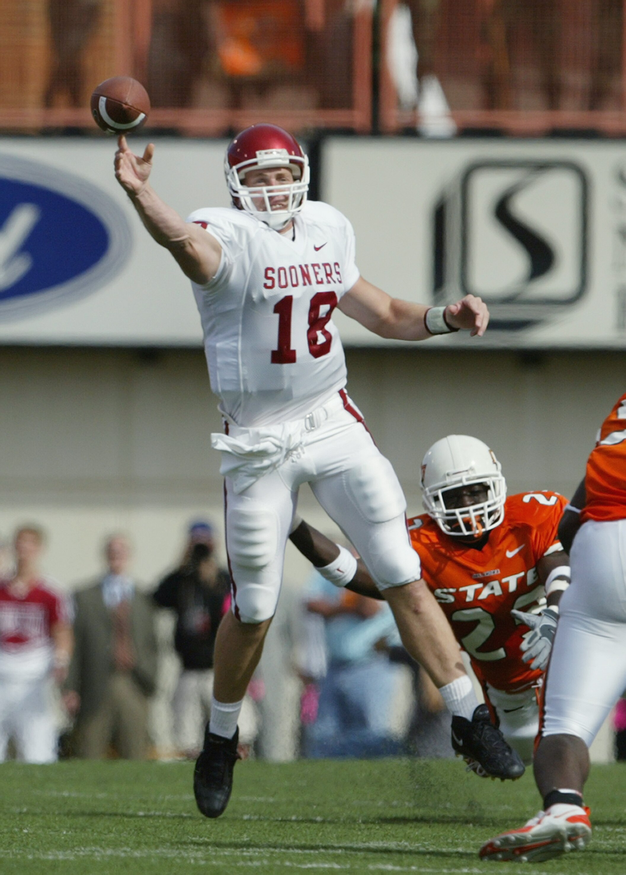 STILLWATER, OK - OCTOBER 30:  Quarterback Jason White #18 of the University of Oklahoma Sooners passes the ball against the Oklahoma State University Cowboys at Boone Pickens Stadium on October 30, 2004 in Stillwater, Oklahoma. STILLWATER, OK - OCTOBER 30