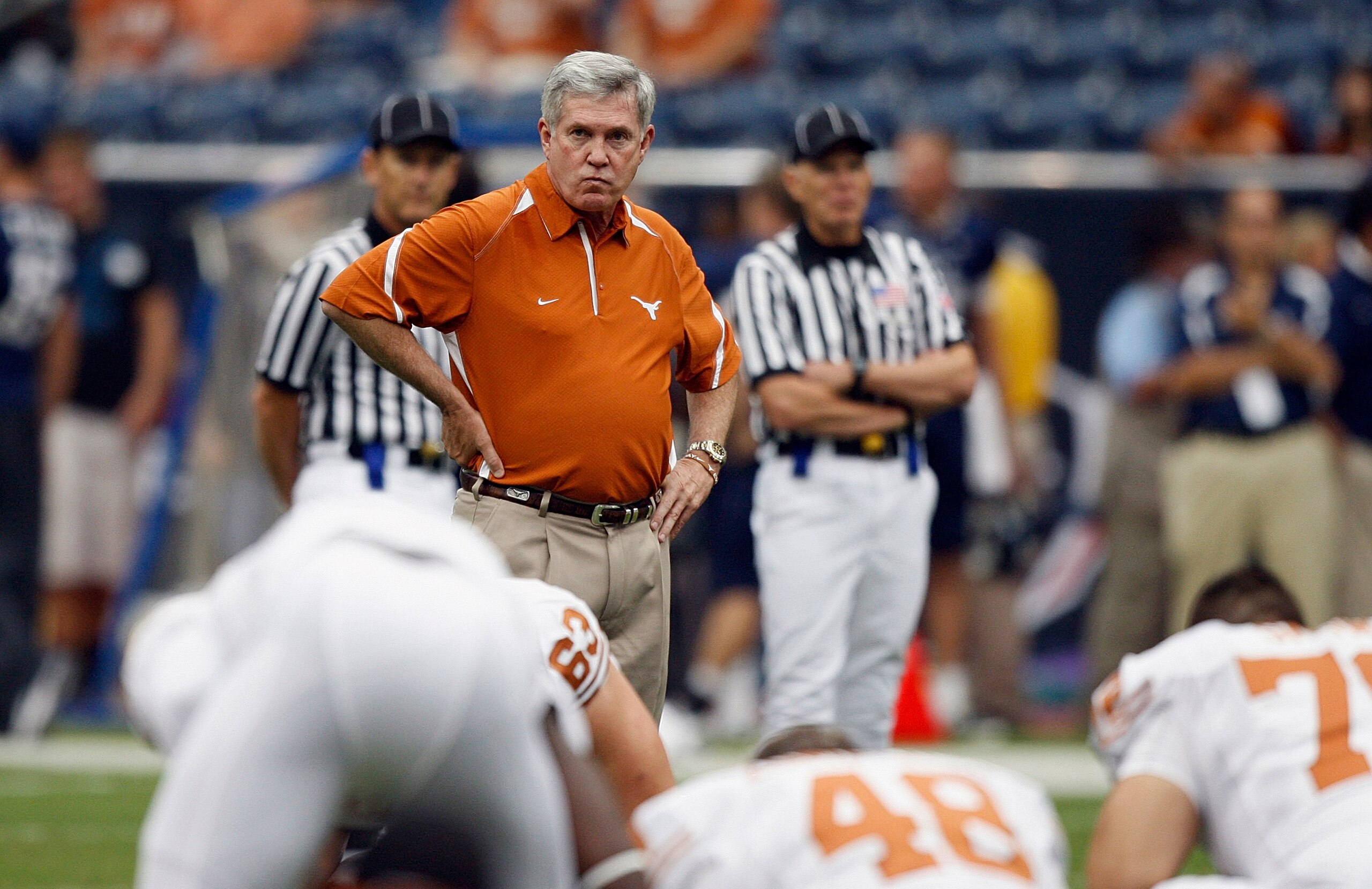 HOUSTON - SEPTEMBER 04:  Head coach Mack Brown of the Texas Longhorns looks over the team during warm ups before playing the Rice Owls at Reliant Stadium on September 4, 2010 in Houston, Texas. Texas beat Rice 34-17.  (Photo by Bob Levey/Getty Images)