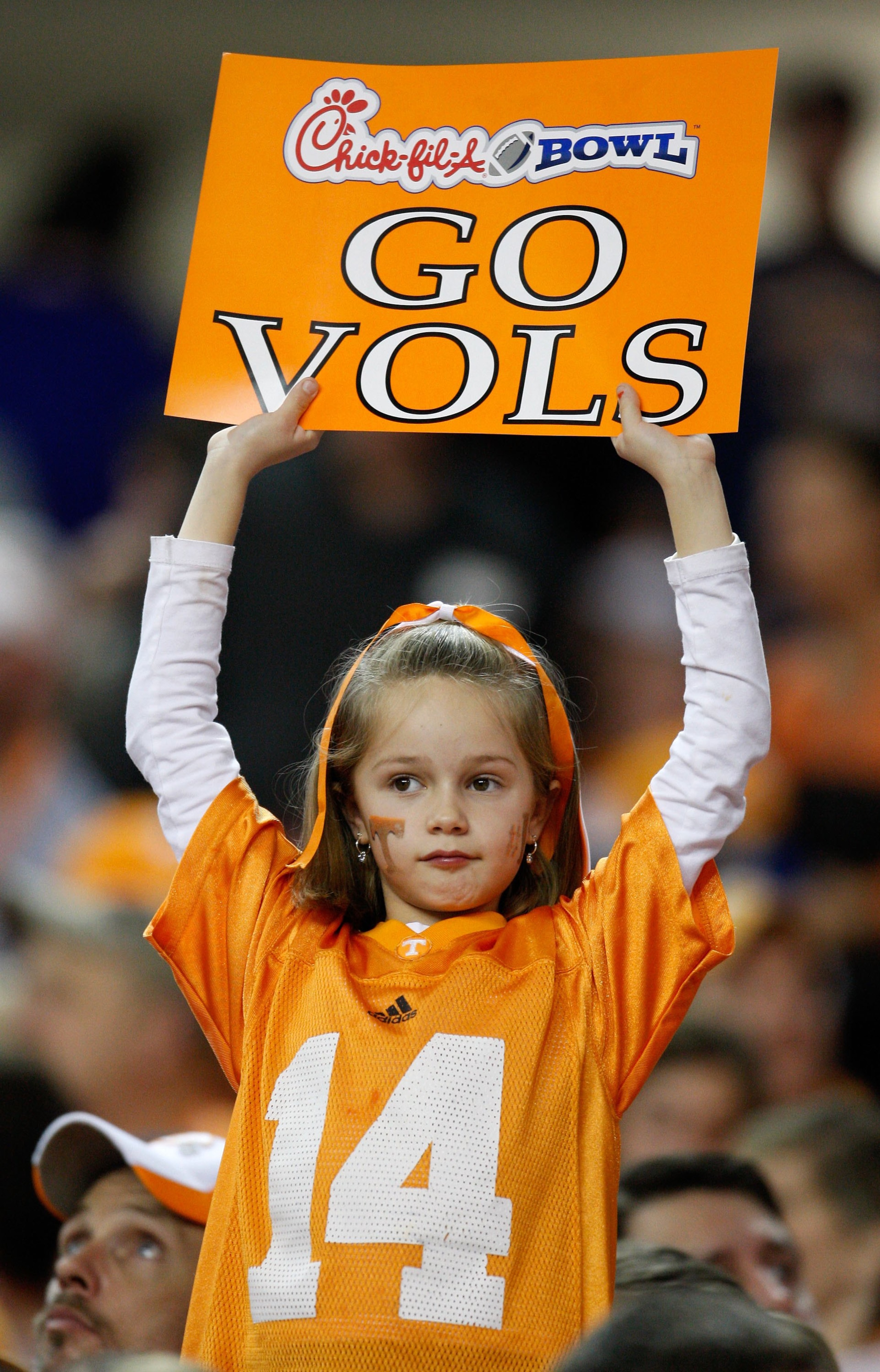 ATLANTA - DECEMBER 31:  A young female Tennessee Volunteers fan holds up a sign to show her support from the stands during the Chick-Fil-A Bowl between the Tennessee Volunteers and the Virginia Tech Hokies at the Georgia Dome on December 31, 2009 in Atlan