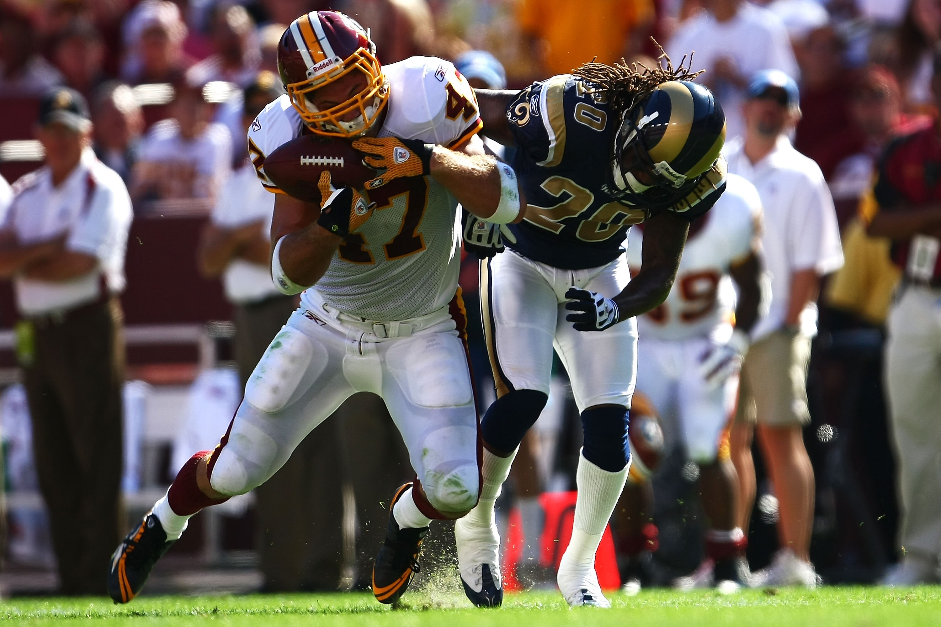 LANDOVER, MD - OCTOBER 12:  Chris Cooley #47 of the Washington Redskins makes a catch under pressure from Jonathan Wade #20 of the St. Louis Rams during their game on October 12, 2008 at FedEx Field in Landover, Maryland.  (Photo by Chris McGrath/Getty Im