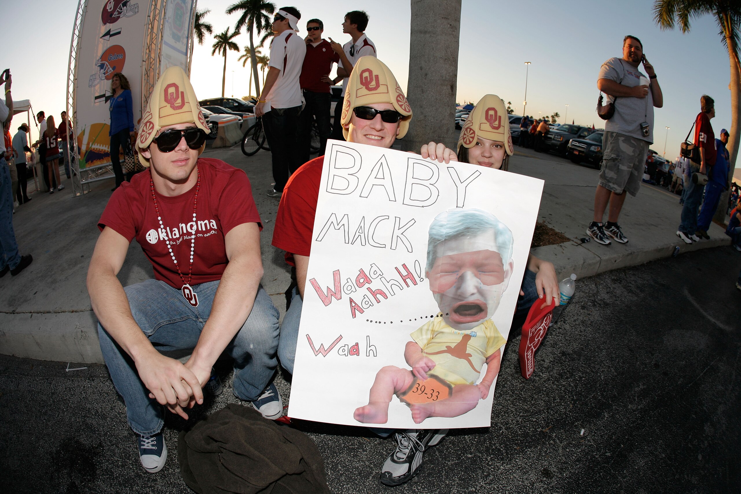 MIAMI - JANUARY 08:  Fans of the Oklahoma Sooners hold up a sign in reference to Mack Brown, head coach of the Texas Longhorns prior to the FedEx BCS National Championship game against the Florida Gators at Dolphin Stadium on January 8, 2009 in Miami, Flo