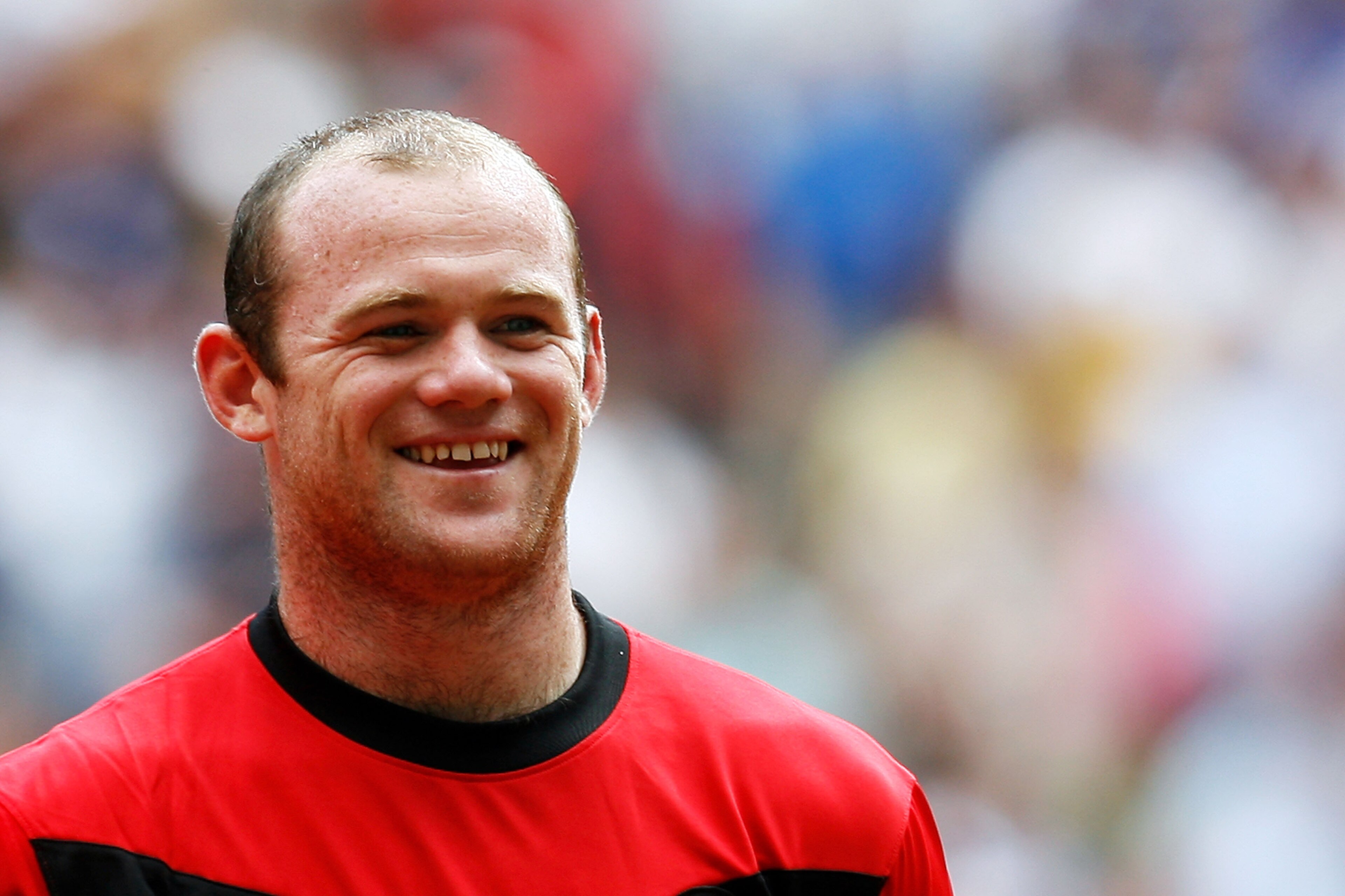 LONDON, ENGLAND - AUGUST 09: Wayne Rooney of Manchester United smiles prior to the FA Community Shield match between Manchester United and Chelsea at Wembley Stadium on August 9, 2009 in London, England. (Photo by Paul Gilham/Getty Images) LONDON, ENGLAND - AUGUST 09: Wayne Rooney of Manchester United smiles prior to the FA Community Shield match between Manchester United and Chelsea at Wembley Stadium on August 9, 2009 in London, England. (Photo by Paul Gilham/Getty Images)