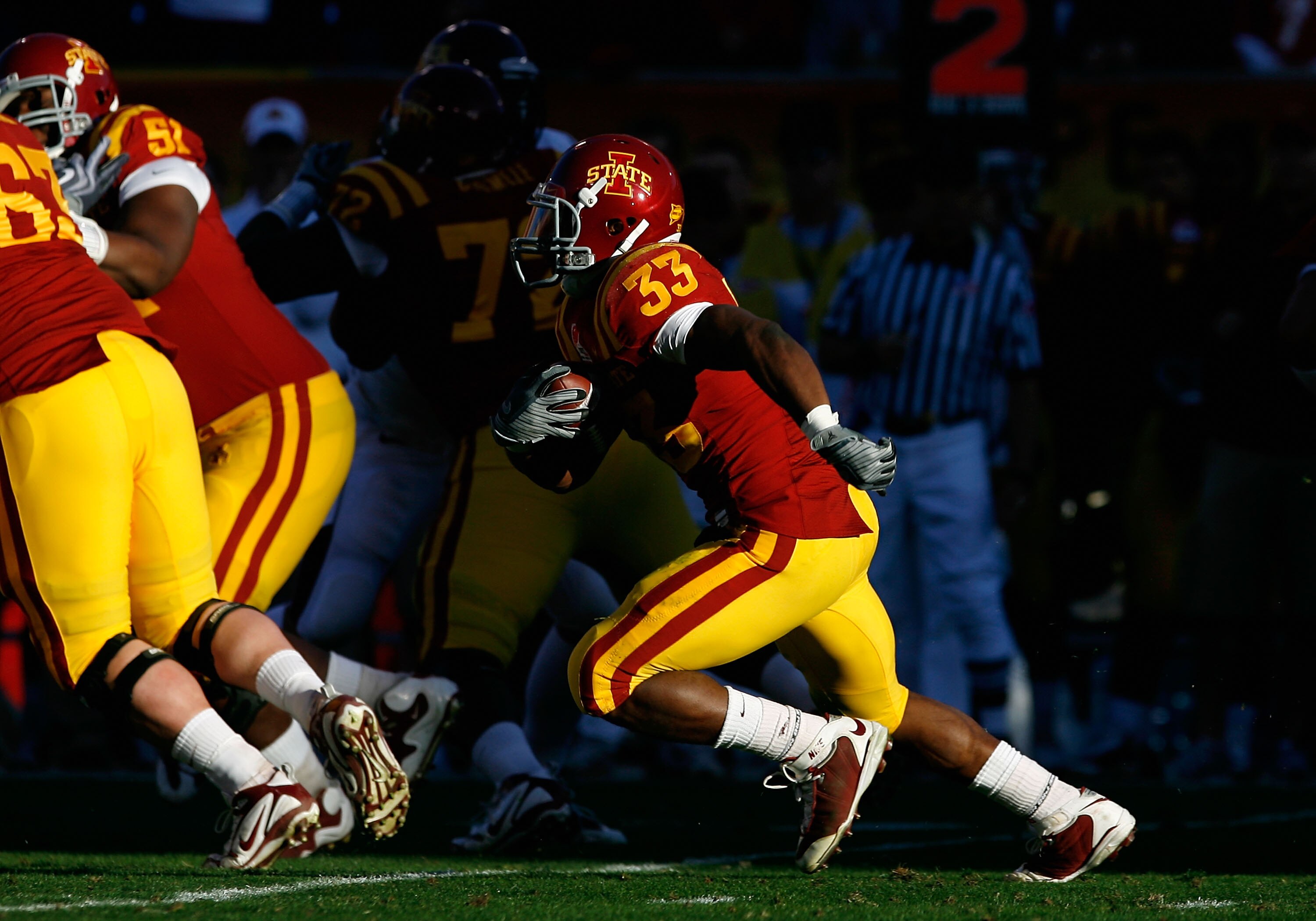 TEMPE, AZ - DECEMBER 31:  Runningback Alexander Robinson #33 of the Iowa State Cyclones rushes the football against the Minnesota Golden Gophers during the Insight Bowl at Arizona Stadium on December 31, 2009 in Tempe, Arizona. The Cyclones defeated the G