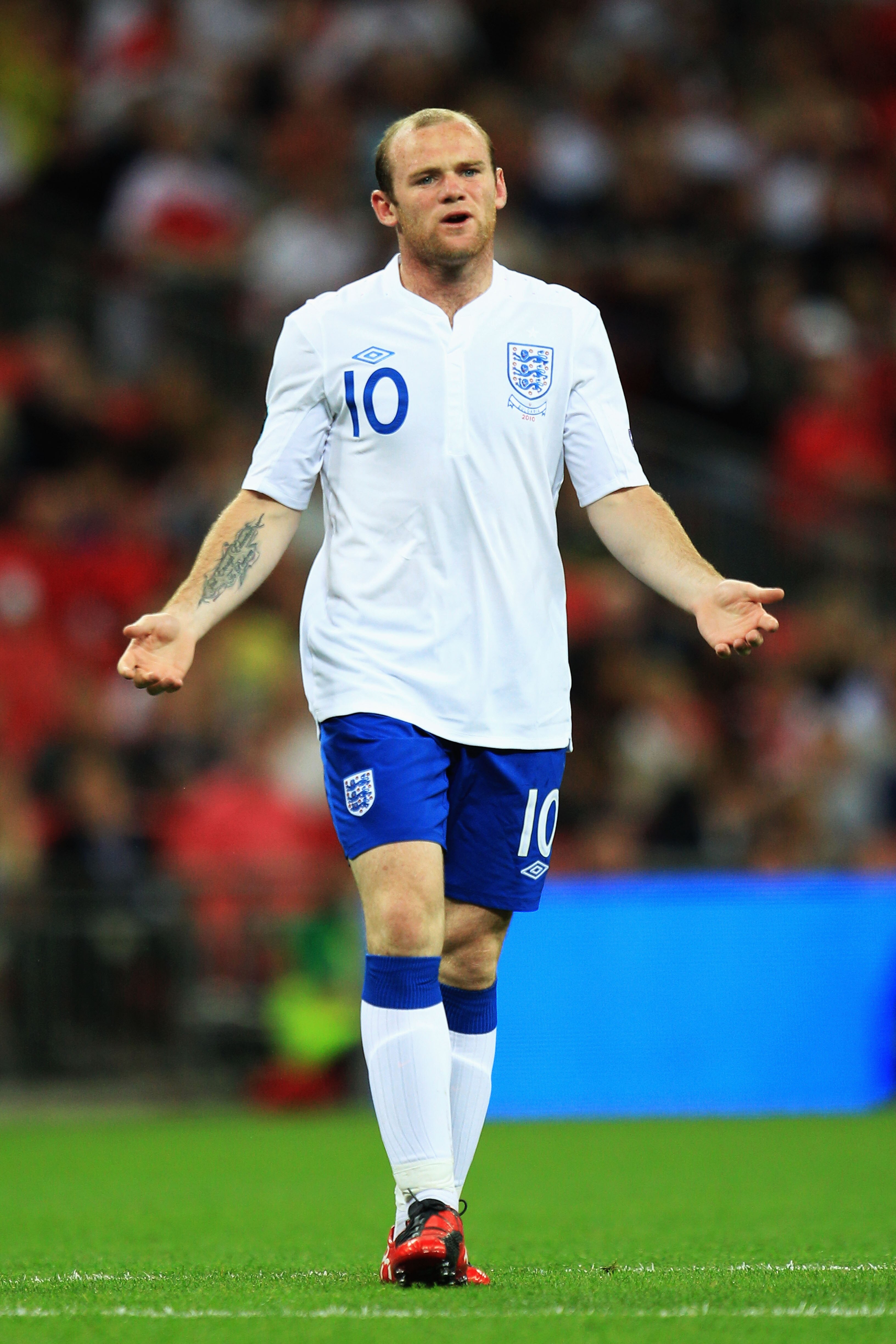 LONDON, ENGLAND - SEPTEMBER 03:  Wayne Rooney of England appeals to match referee Viktor Kassai of Hungary during the UEFA EURO 2012 Group G Qualifying match between England and Bulgaria at Wembley Stadium on September 3, 2010 in London, England.  (Photo