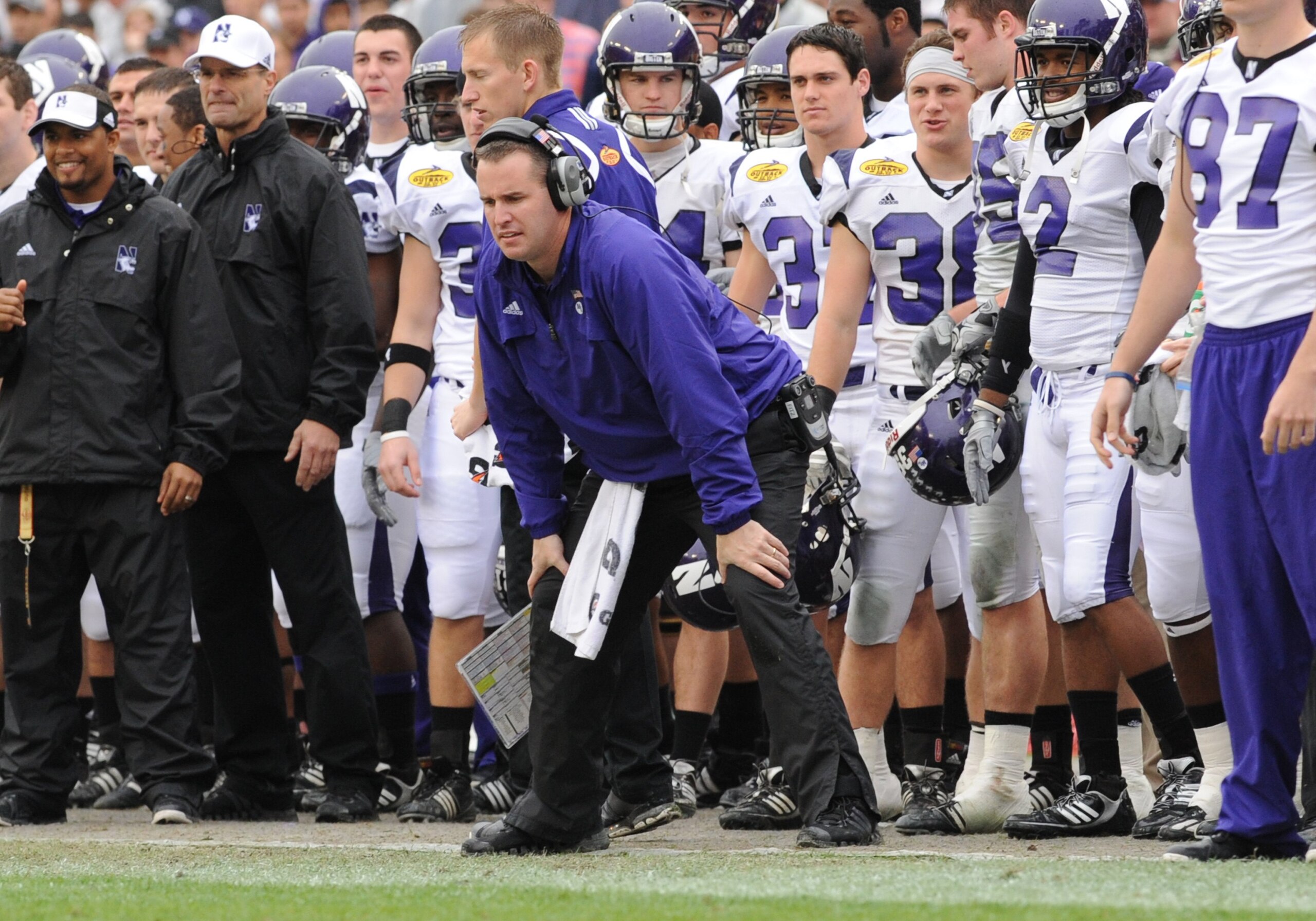 TAMPA, FL - JANUARY 1: Coach Pat Fitzgerald of the Northwestern Wildcats directs play against the Auburn Tigers in the Outback Bowl January 1, 2010 at Raymond James Stadium in Tampa, Florida.  (Photo by Al Messerschmidt/Getty Images)
