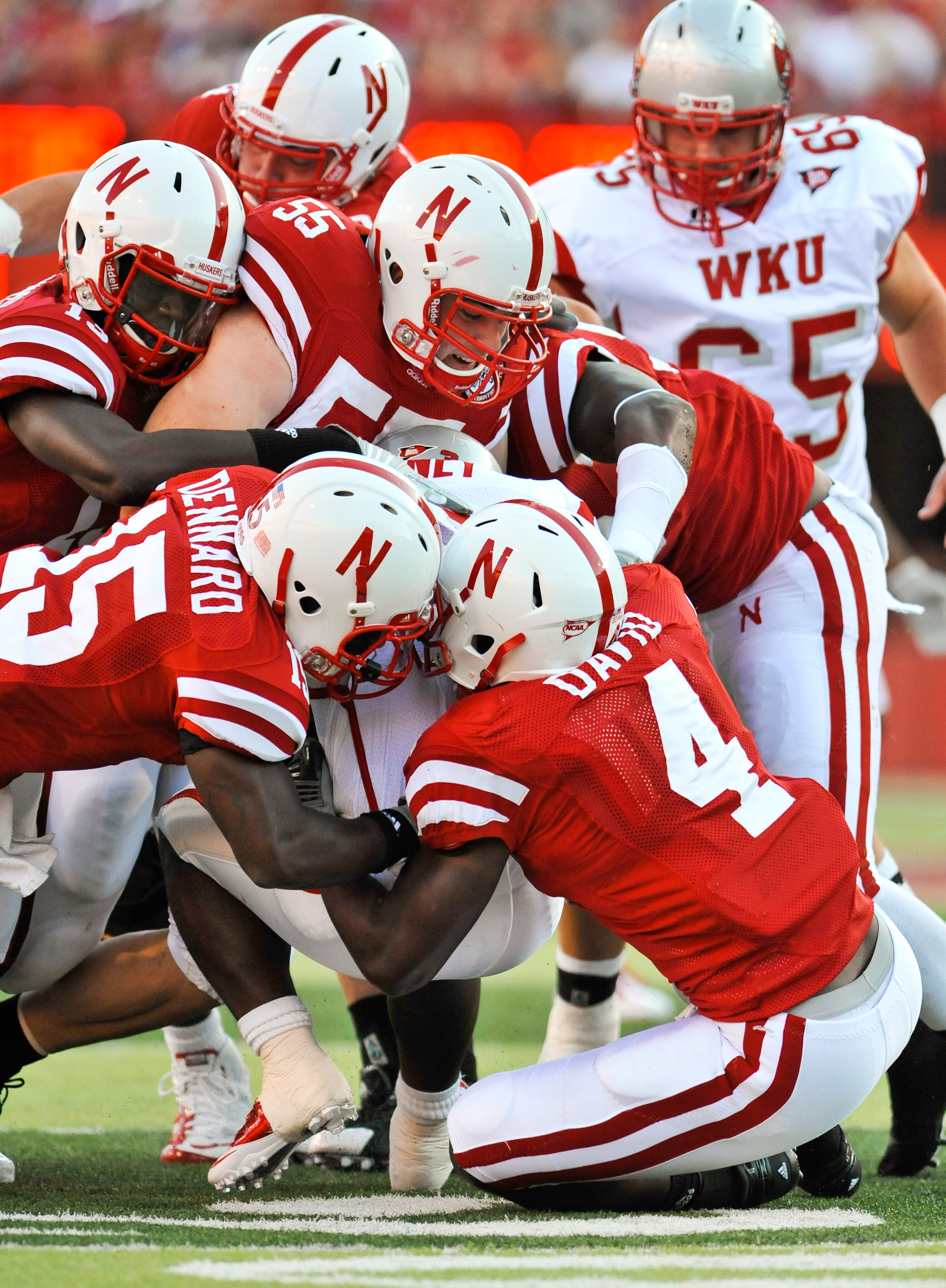 LINCOLN, NE - SEPTEMBER 04:  The Nebraska Cornhuskers  defense swarms Bobby Rainey of the Western Kentucky Hilltoppers during the first half of their game at Memorial Stadium on September 4, 2010 in Lincoln, Nebraska. Nebraska defeated Western Kentucky 49