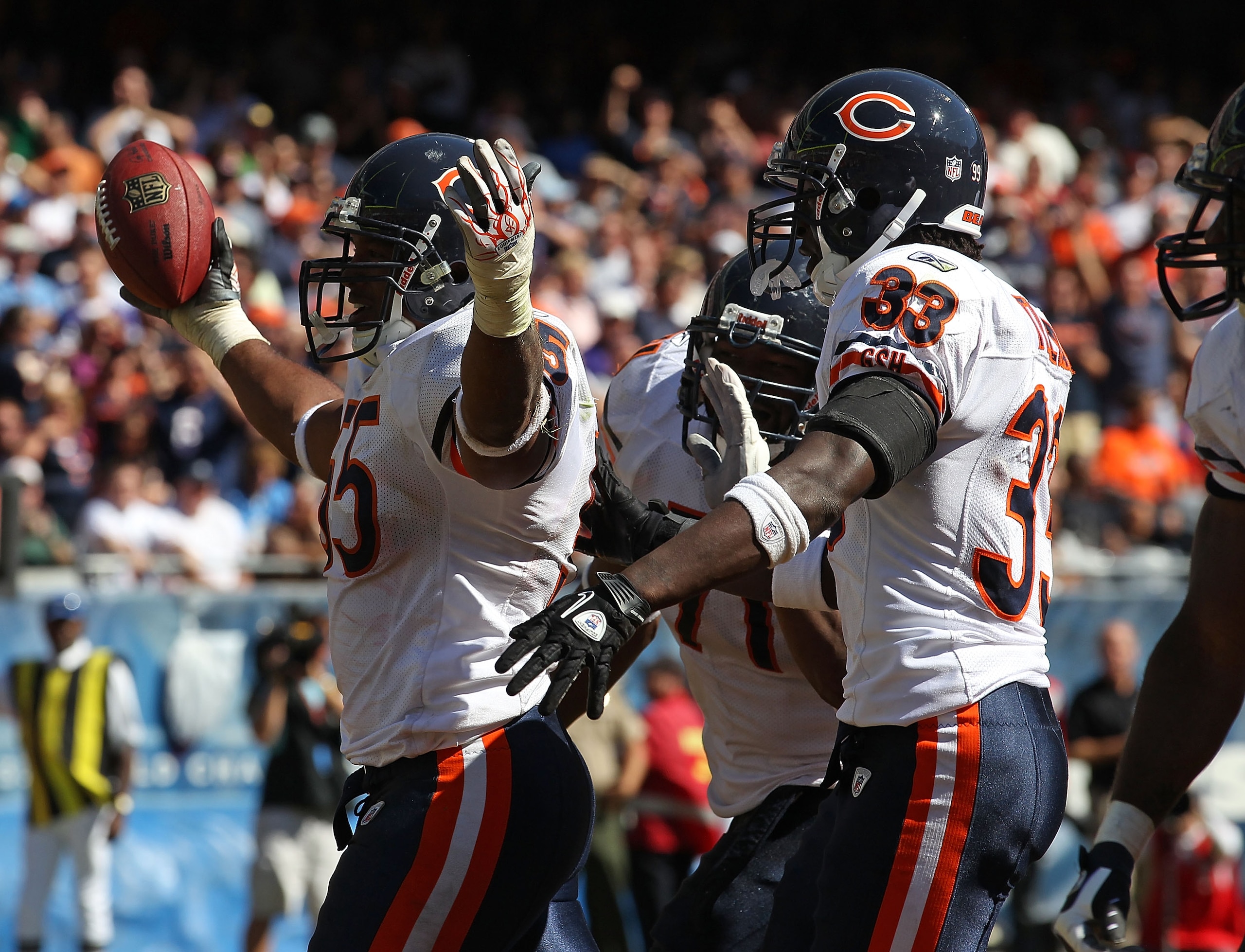 CHICAGO - SEPTEMBER 12: Lance Briggs #55 of the Chicago Bears celebrates a turn-over with teammates Israel Idonije #71 and Charles Tillman #33 during the NFL season opening game against the Detroit Lions at Soldier Field on September 12, 2010 in Chicago,