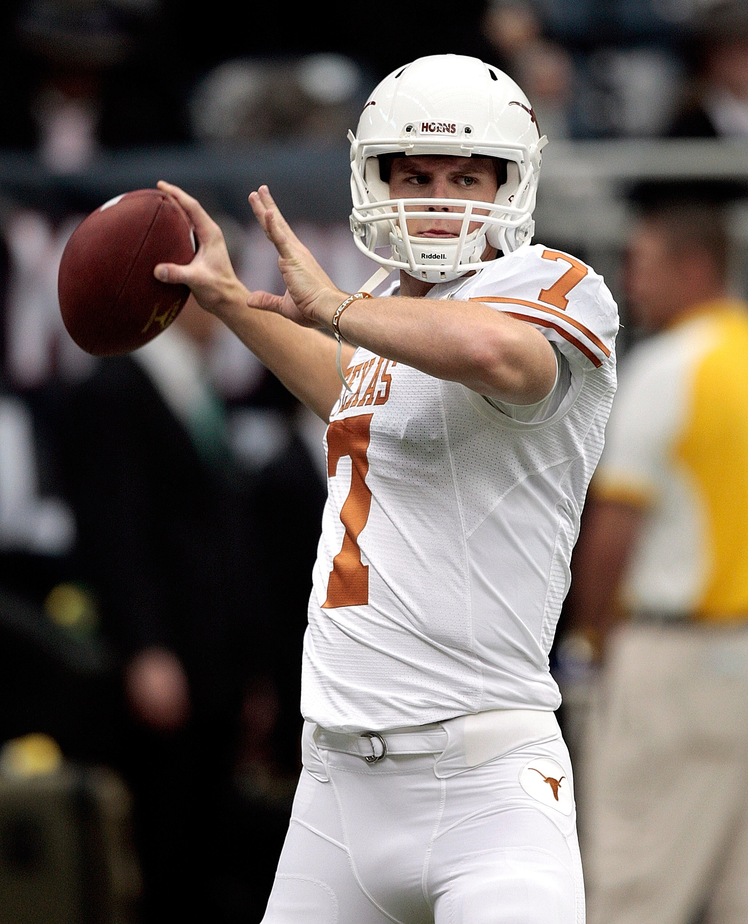 HOUSTON - SEPTEMBER 04:  Quarterback Garrett Gilbert #7 of the Texas Lonhgorns throws passes during pre-game warmups before playing the Rice Owls at Reliant Stadium on September 4, 2010 in Houston, Texas. Texas beat Rice 34-17.  (Photo by Bob Levey/Getty