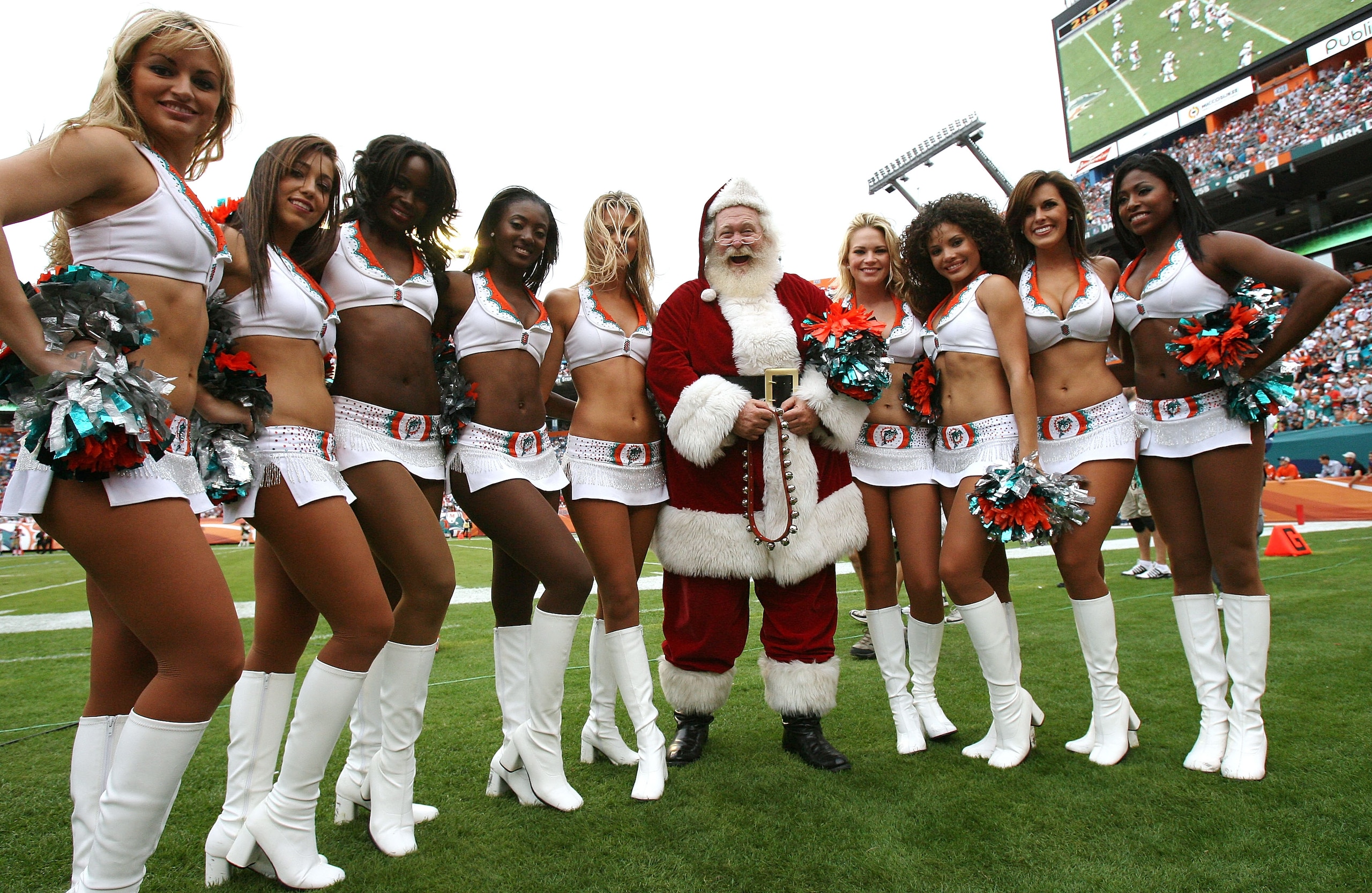 MIAMI - DECEMBER 14:  Cheerleaders pose with Santa Claus as the San Francisco 49ers take on the Miami Dolphins at Dolphin Stadium on December 14, 2008 in Miami, Florida. The Dolphins defeated the 49ers 14-9.  (Photo by Doug Benc/Getty Images)