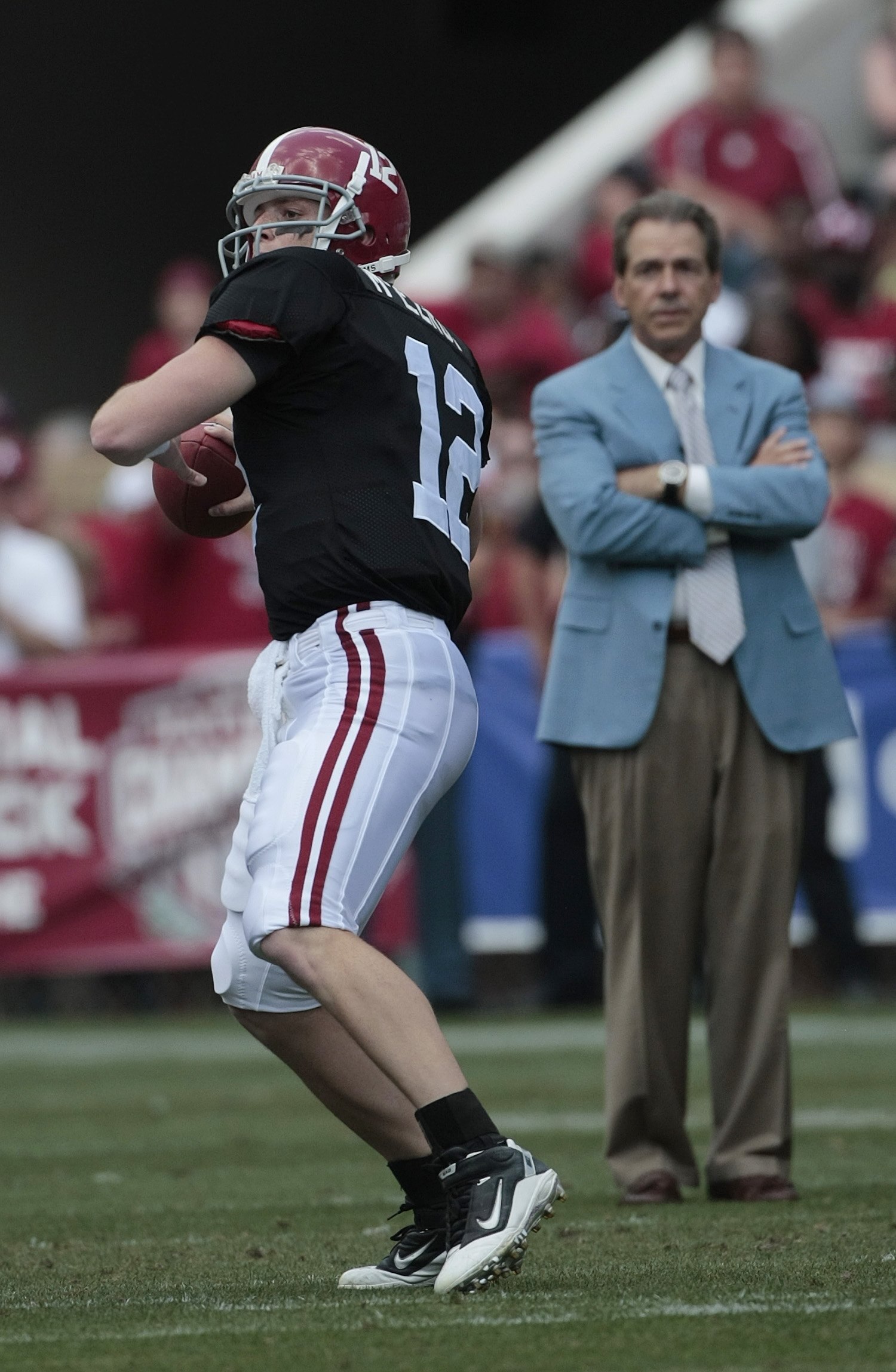 TUSCALOOSA, AL - APRIL 17:  Coach Nick Saban of the Alabama Crimson Tide watches quarterback Greg McElroy #12 throw during the Alabama spring game at Bryant Denny Stadium on April 17, 2010 in Tuscaloosa, Alabama. (Photo by Dave Martin/Getty Images)