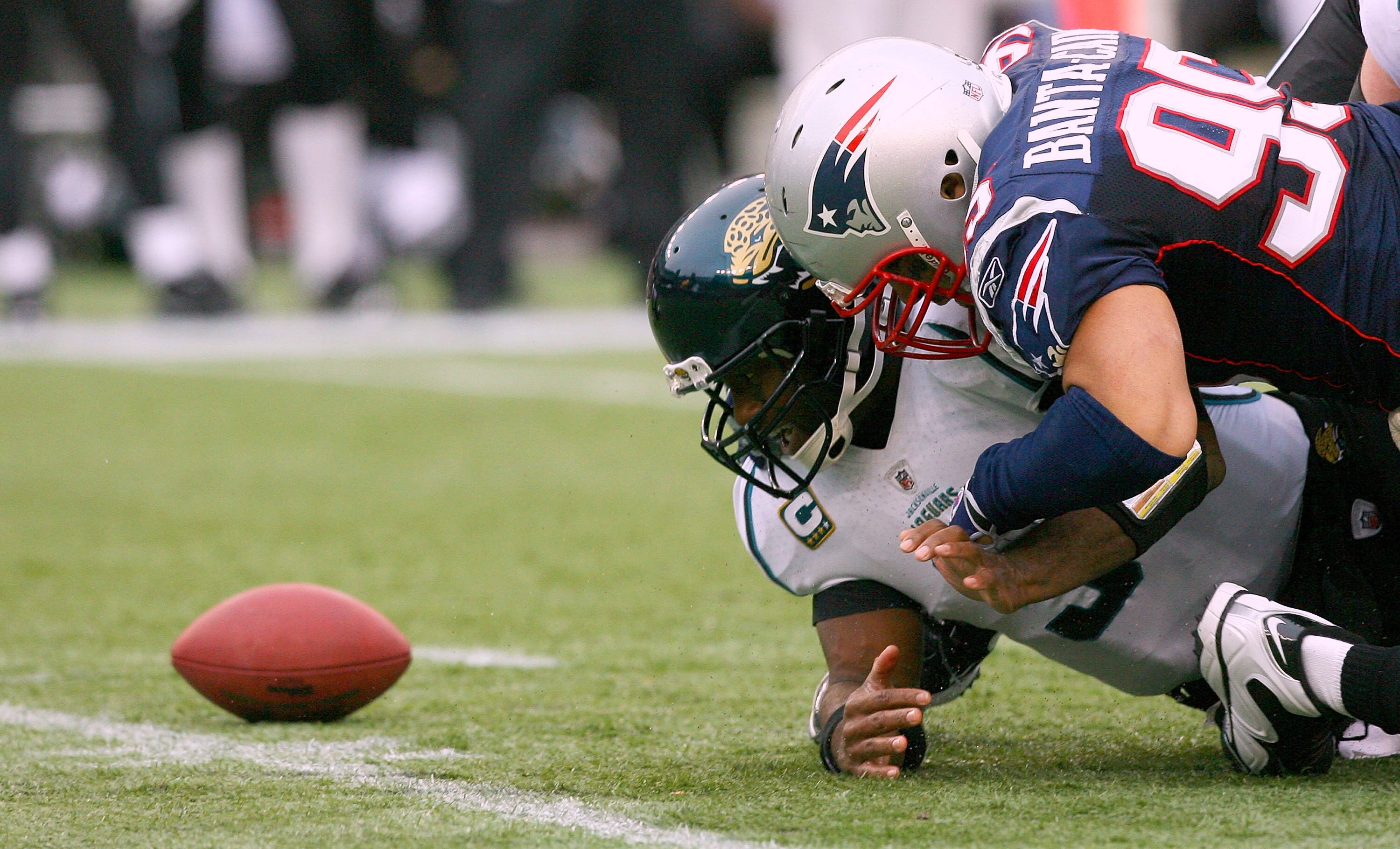 FOXBORO, MA - DECEMBER 27:  David Garrard #9 of  the Jacksonville Jaguars loses control of the ball against the defense Tully Banta-Cain #95 of New England Patriots at Gillette Stadium on December 27, 2009 in Foxboro, Massachusetts. The Patriots won 35-7.