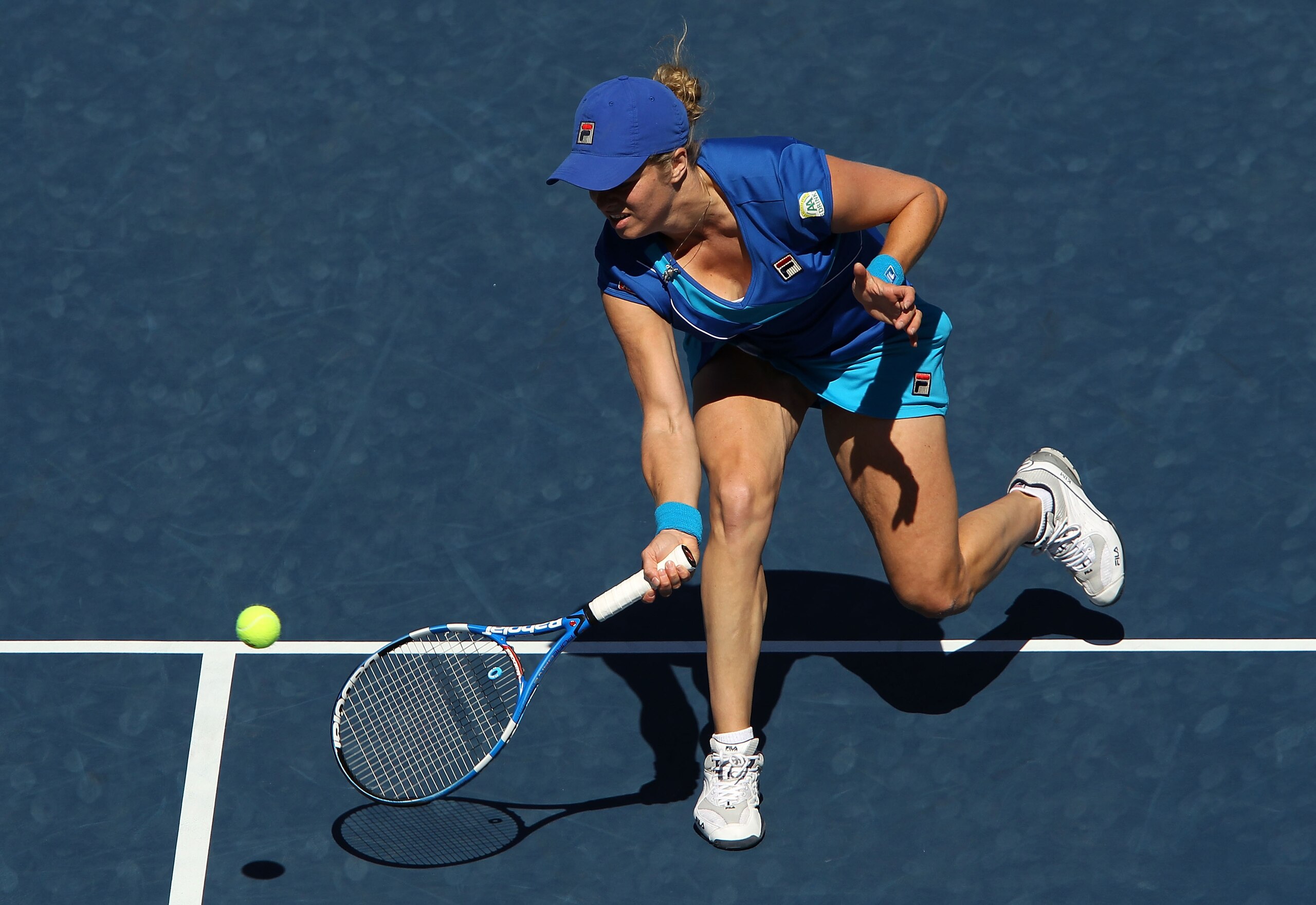 NEW YORK - SEPTEMBER 05: Kim Clijsters of Belgium returns a shot against Ana Ivanovic of Serbia during her women's singles match on day seven of the 2010 U.S. Open at the USTA Billie Jean King National Tennis Center on September 5, 2010 in the Flushing n NEW YORK - SEPTEMBER 05: Kim Clijsters of Belgium returns a shot against Ana Ivanovic of Serbia during her women's singles match on day seven of the 2010 U.S. Open at the USTA Billie Jean King National Tennis Center on September 5, 2010 in the Flushing n