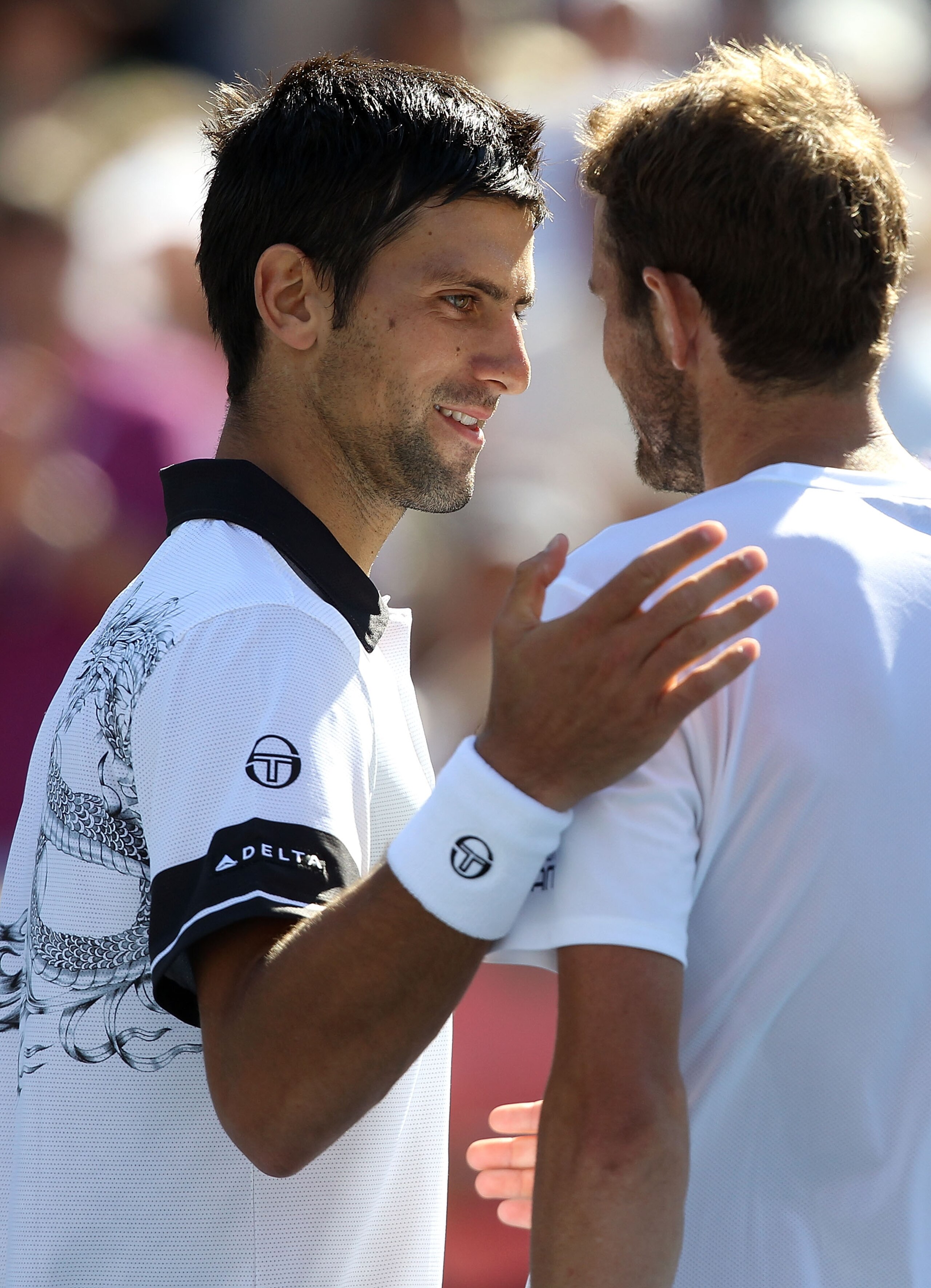NEW YORK - SEPTEMBER 06: Novak Djokovic of Serbia (L) and Mardy Fish of the United States (R) shake hands at the net after the men's singles match on day eight of the 2010 U.S. Open at the USTA Billie Jean King National Tennis Center on September 6, 2010 NEW YORK - SEPTEMBER 06: Novak Djokovic of Serbia (L) and Mardy Fish of the United States (R) shake hands at the net after the men's singles match on day eight of the 2010 U.S. Open at the USTA Billie Jean King National Tennis Center on September 6, 2010