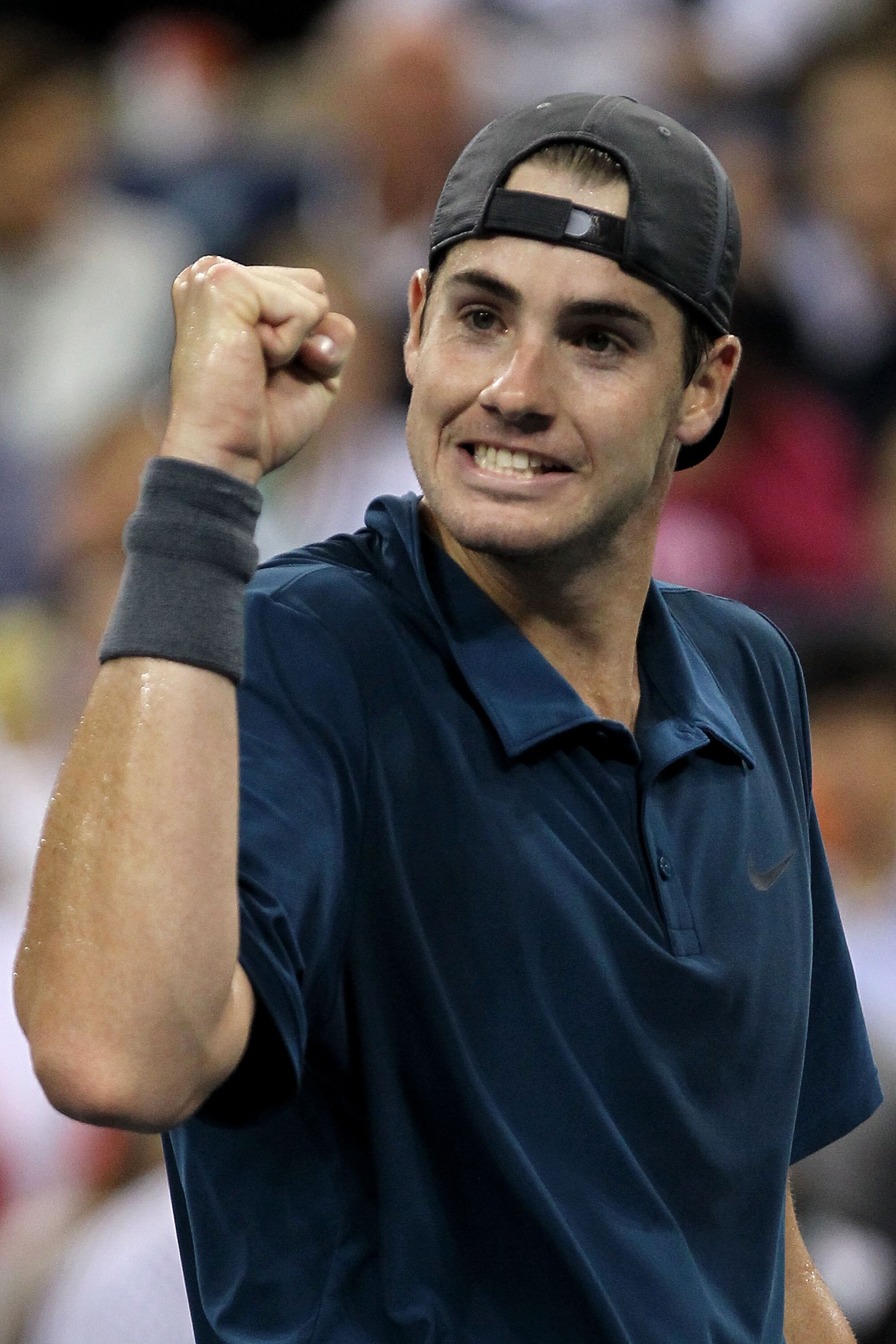 NEW YORK - SEPTEMBER 05:  John Isner of the United States reacts against Mikhail Youzhny of Russia during the men's singles match on day seven of the 2010 U.S. Open at the USTA Billie Jean King National Tennis Center on September 5, 2010 in the Flushing n