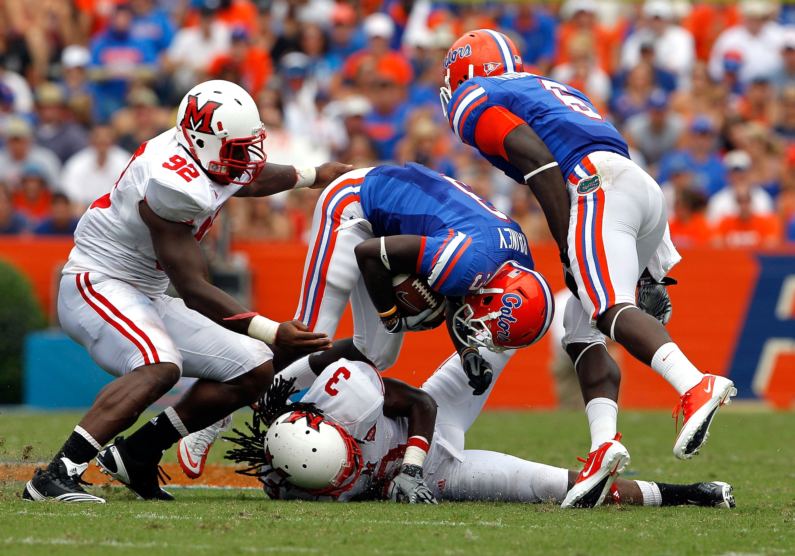 GAINESVILLE, FL - SEPTEMBER 04:  Receiver Chris Rainey #3 of the Florida Gators attempts to run past Dayonne Nunley #3 of the Miami University RedHawks at Ben Hill Griffin Stadium on September 4, 2010 in Gainesville, Florida.  (Photo by Sam Greenwood/Gett