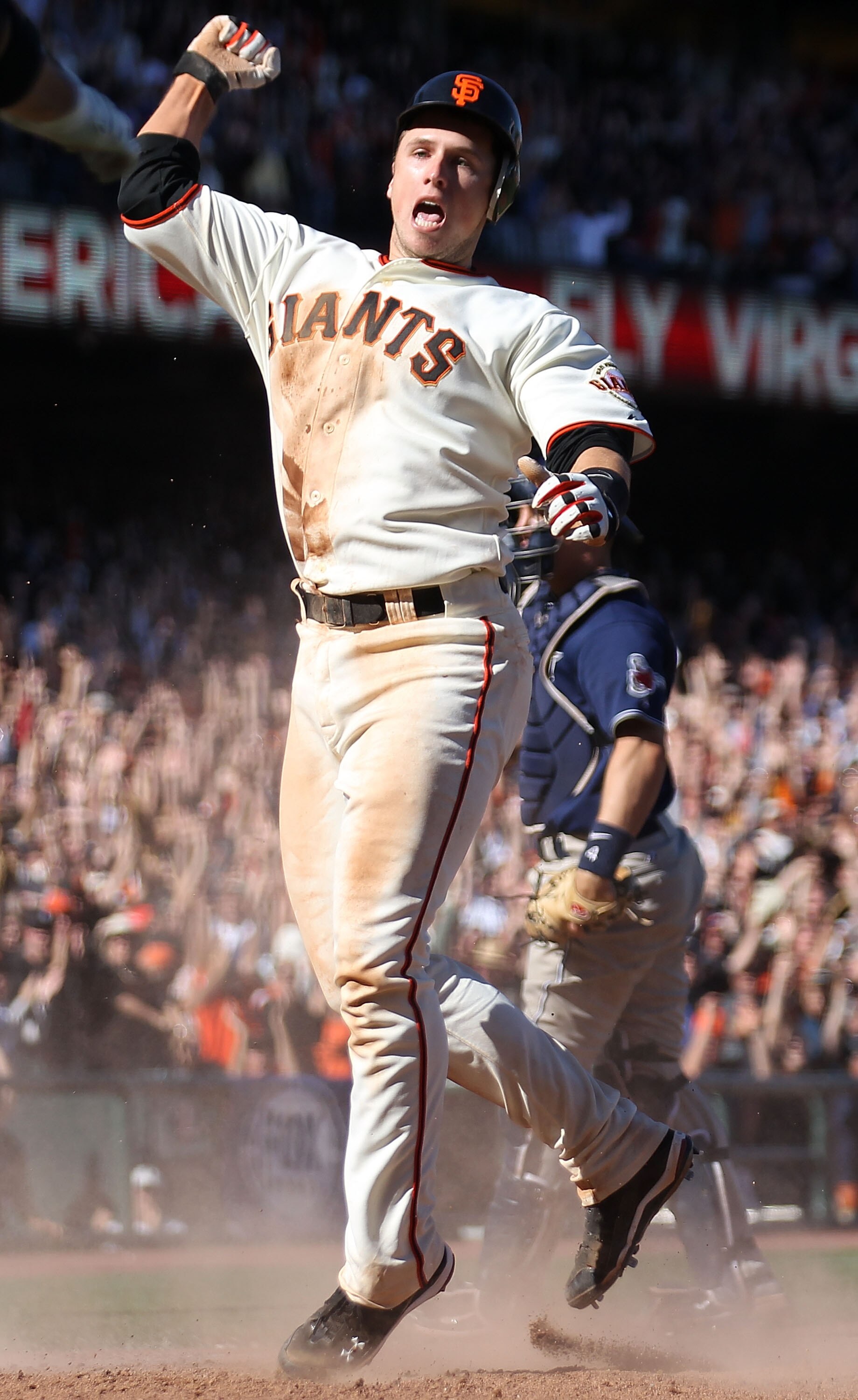 SAN FRANCISCO - AUGUST 14:  Buster Posey #28 of the San Francisco Giants celebrates after scoring the game winning run on a single by Juan Uribe against the San Diego Padres in the eleventh inning during an MLB game at AT&T Park on August 14, 2010 in San 