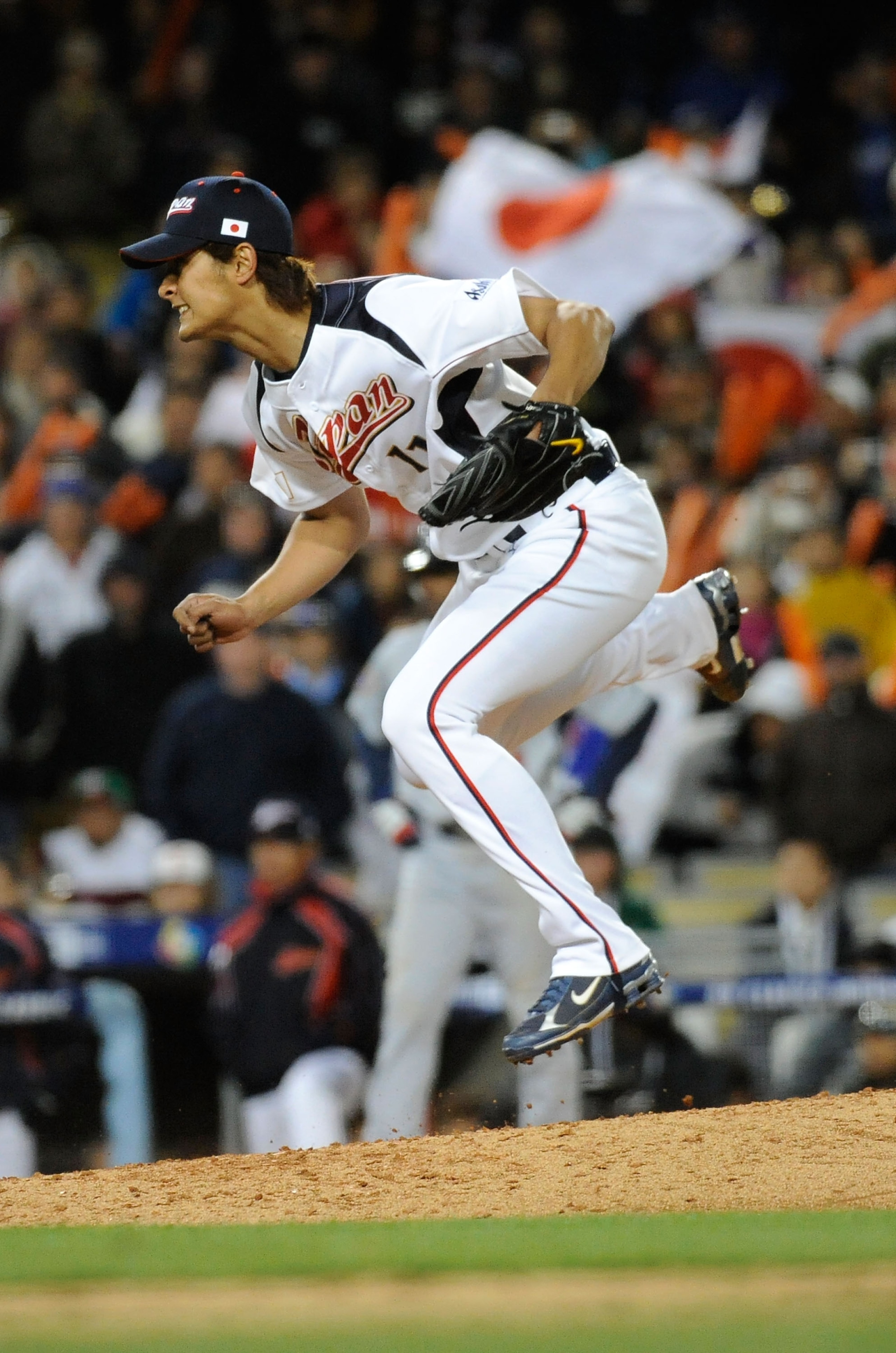 LOS ANGELES - MARCH 22: Pitcher Yu Darvish #11 of Japan celebrates after striking out Adam Dunn #17 of the United States to win the semifinal game of the 2009 World Baseball Classic on March 22, 2009 at Dodger Stadium in Los Angeles, California. Japan def