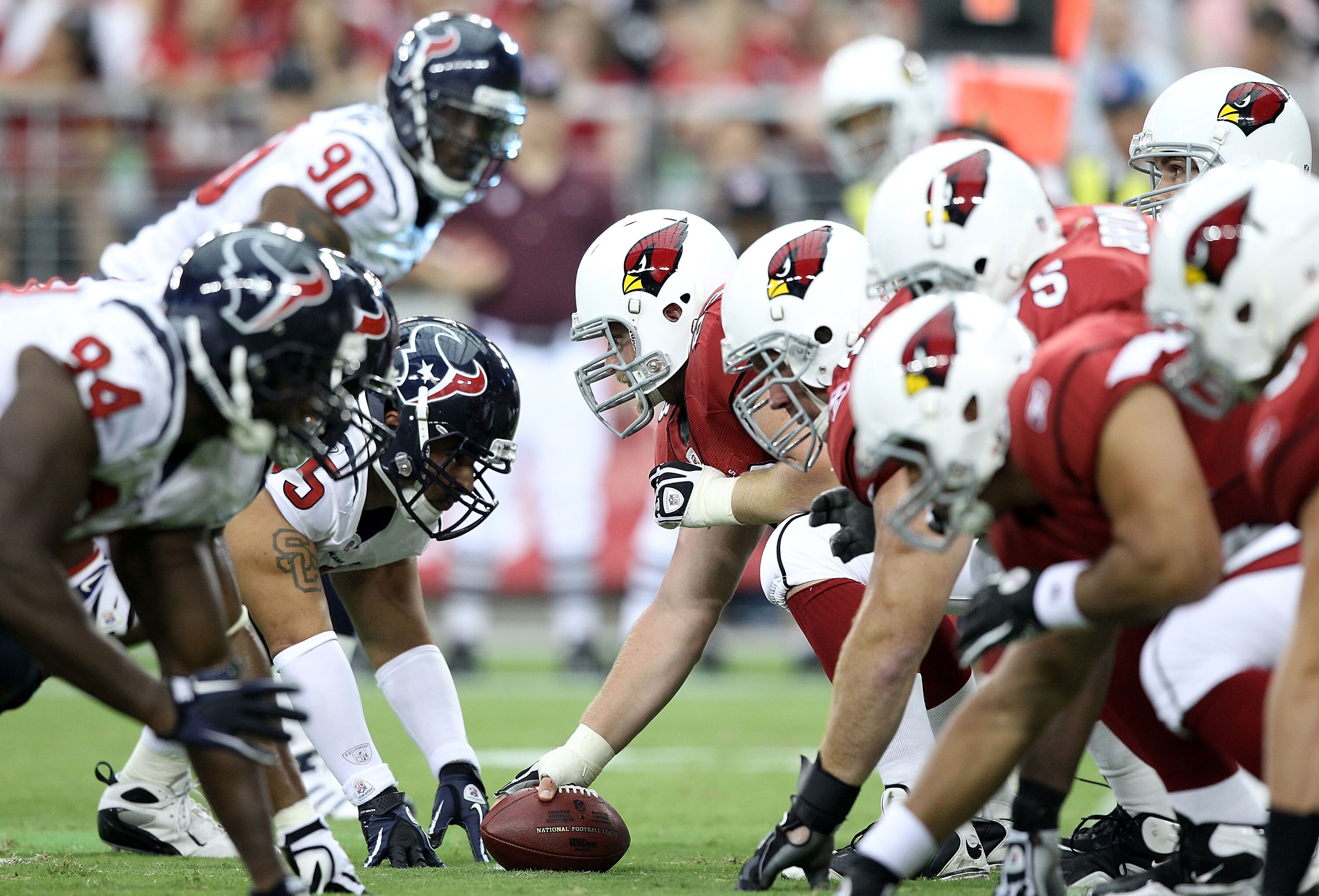 GLENDALE, AZ - AUGUST 14:  Center Lyle Sendlein #63 of the Arizona Cardinals prepares to snap the ball during preseason NFL game against the Houston Texans at the University of Phoenix Stadium on August 14, 2010 in Glendale, Arizona.  (Photo by Christian 