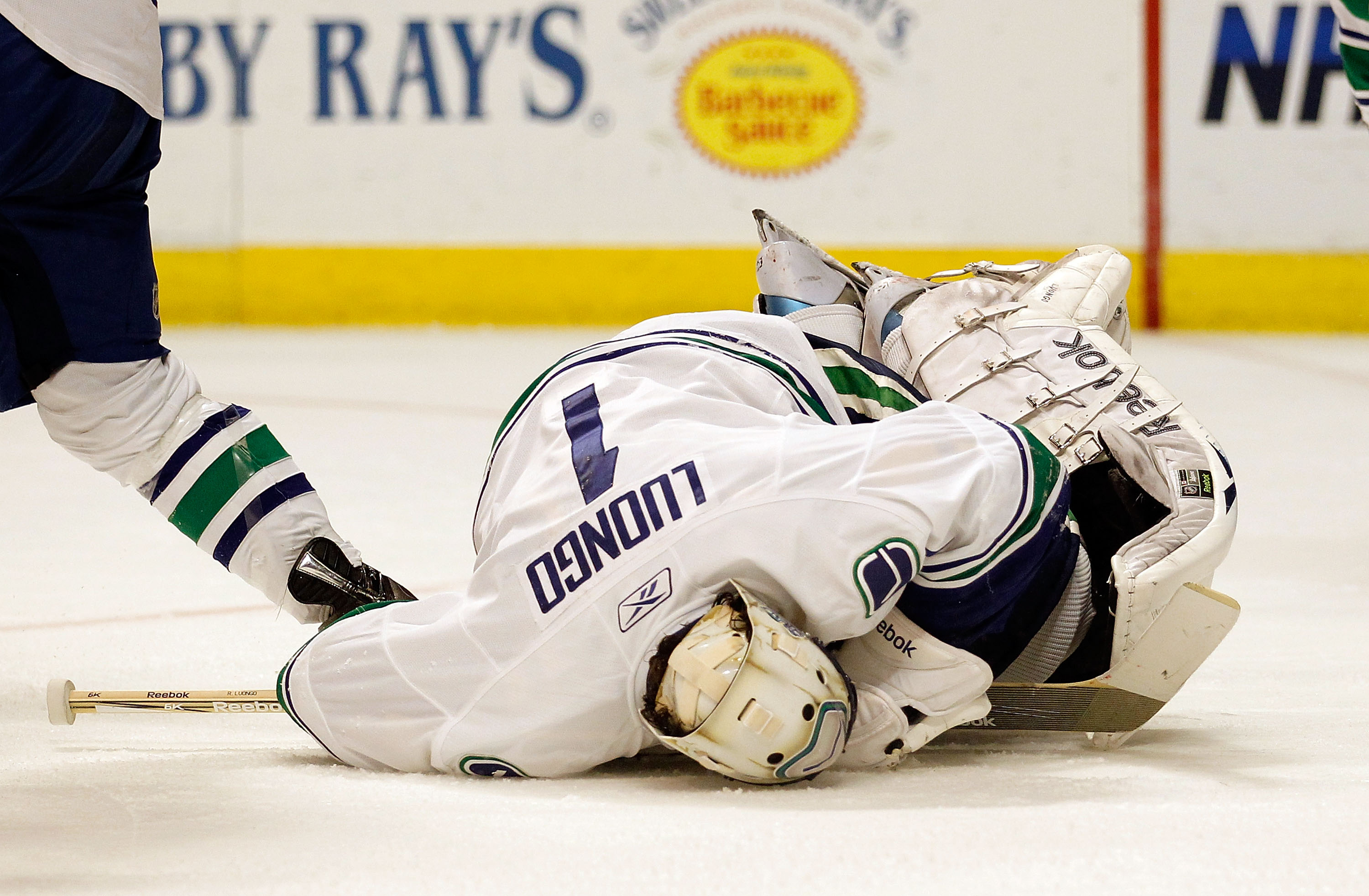 CHICAGO - MAY 03: Roberto Luongo #1 of the Vancouver Canucks falls on the puck for a save against the Chicago Blackhawks in Game Two of the Western Conference Semifinals during the 2010 NHL Stanley Cup Playoffs at United Center on May 3, 2010 in Chicago, CHICAGO - MAY 03: Roberto Luongo #1 of the Vancouver Canucks falls on the puck for a save against the Chicago Blackhawks in Game Two of the Western Conference Semifinals during the 2010 NHL Stanley Cup Playoffs at United Center on May 3, 2010 in Chicago,