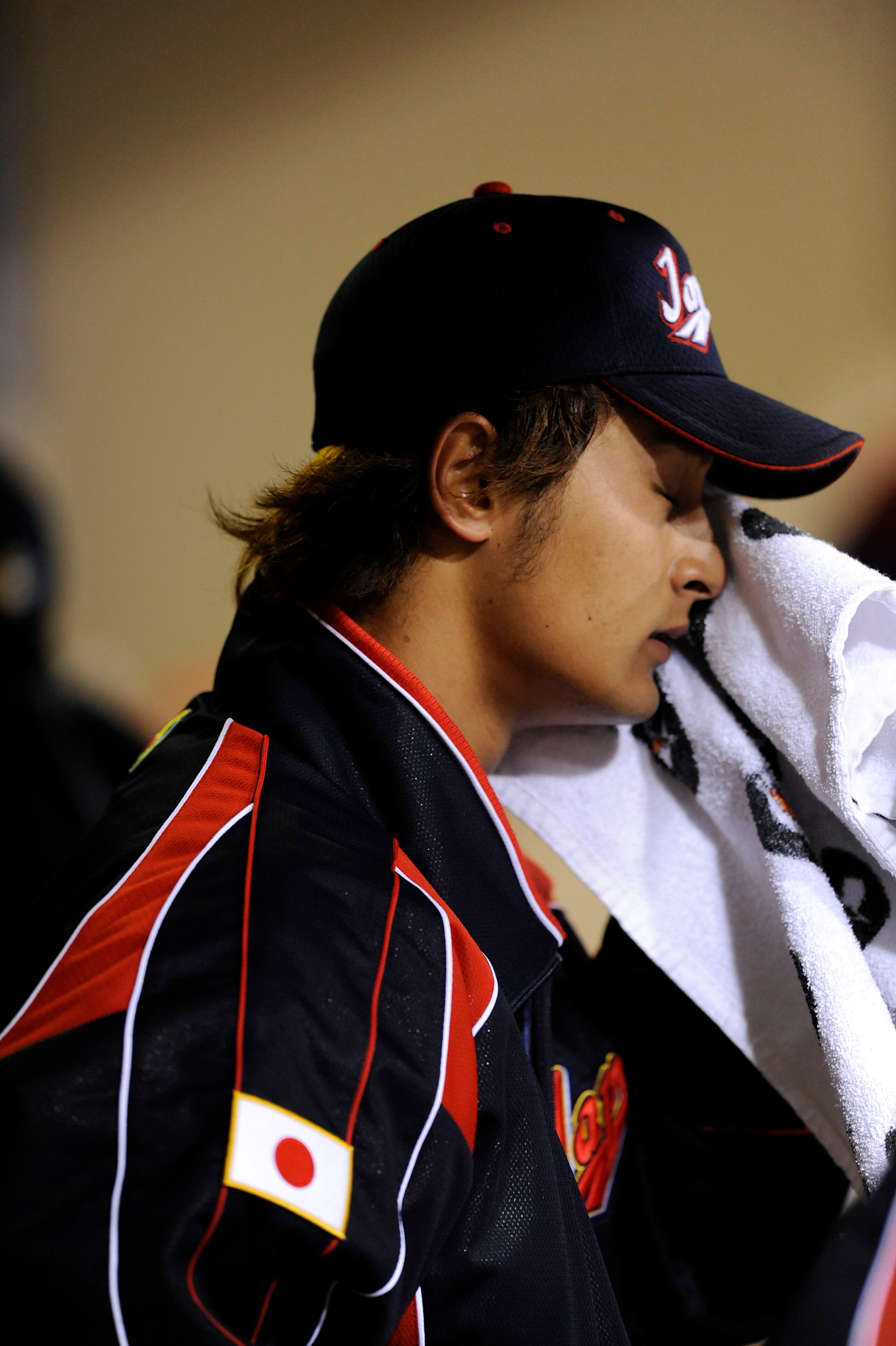 SAN DIEGO - MARCH 17:  Pitcher Yu Darvish #11 of Japan sits on the bench after giving up three runs in the first against Korea during the 2009 World Baseball Classic Round 2 Pool 1 Game 4 on March 17, 2009 at Petco Park in San Diego, California.  (Photo b