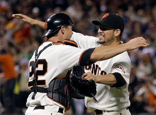 Sanchez hugging catcher, Whiteside and celebrating his no-hitter on July 10, 2009. (Vs SDP)
