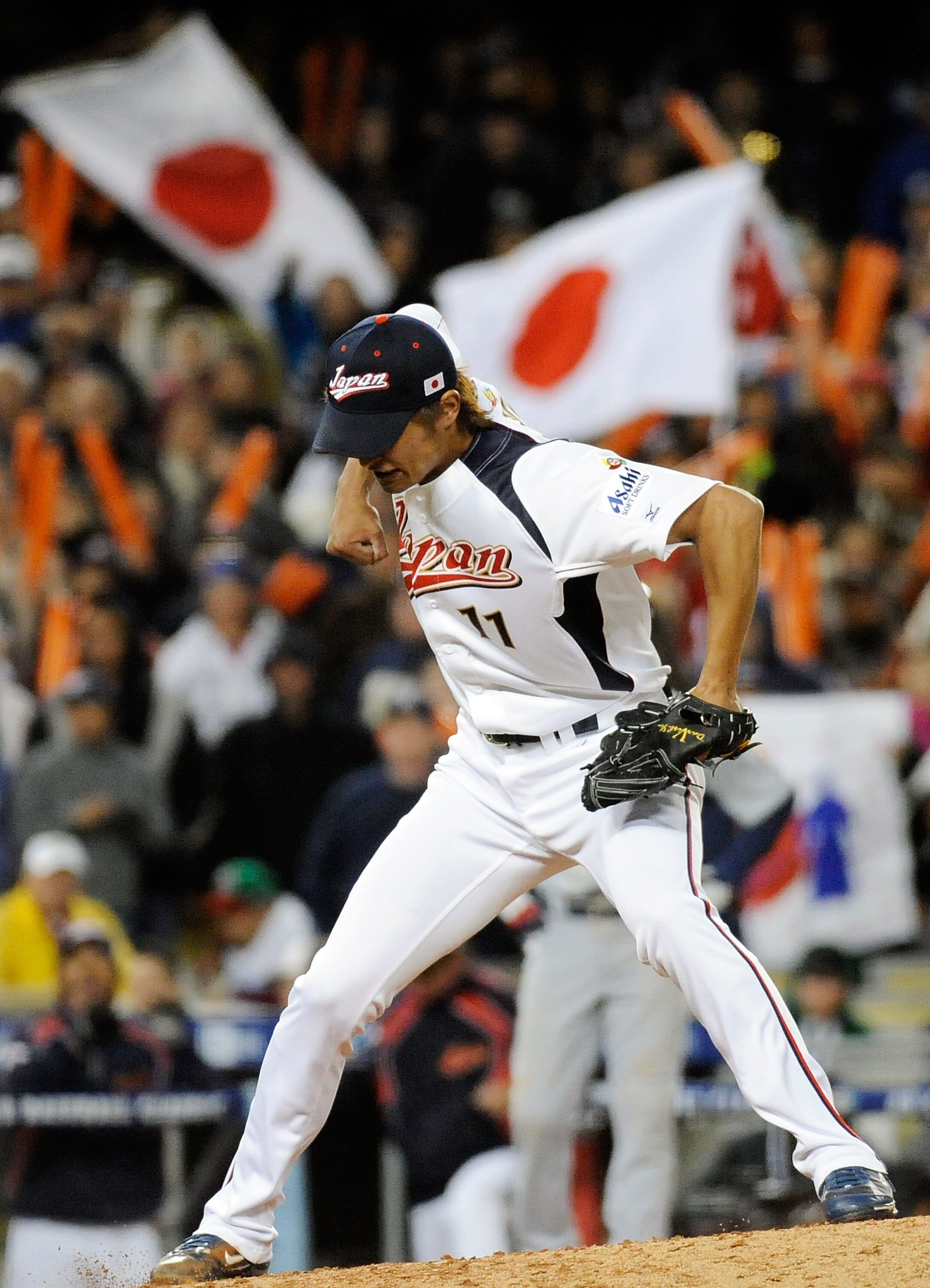 LOS ANGELES, CA - MARCH 22:  Pitcher Yu Darvish #11 of Japan celebrates after striking out Adam Dunn #17 of the United States to win the semifinal game of the 2009 World Baseball Classic on March 22, 2009 at Dodger Stadium in Los Angeles, California. Japa