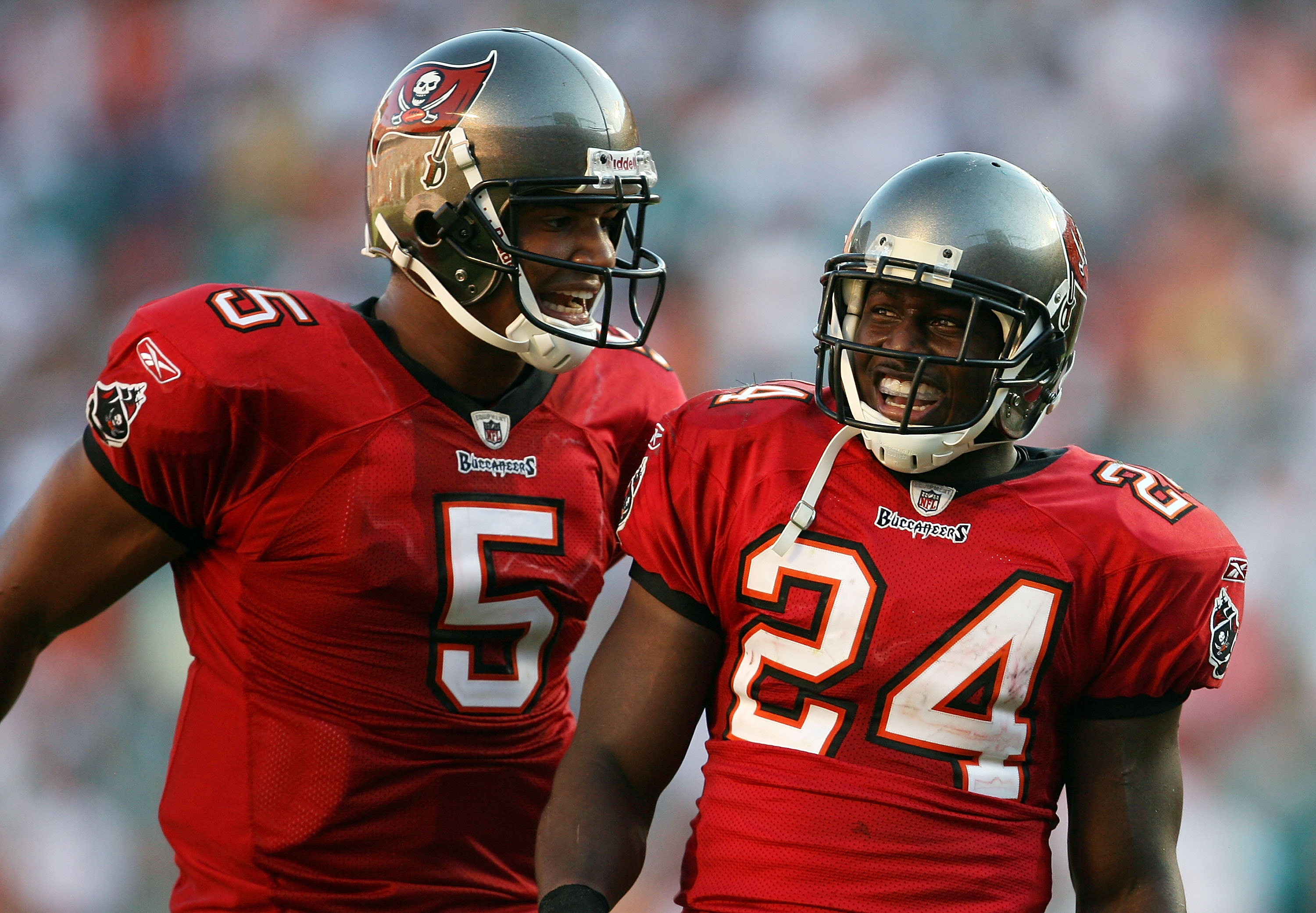 MIAMI GARDENS, FL - NOVEMBER 15: Quarterback Josh Freeman #5 celebrates with running back Carnell Williams #24 of the Tampa Bay Buccaneers after Willliams' fourth quarter touchdown run against the Miami Dolphins at Land Shark Stadium on November 15, 2009