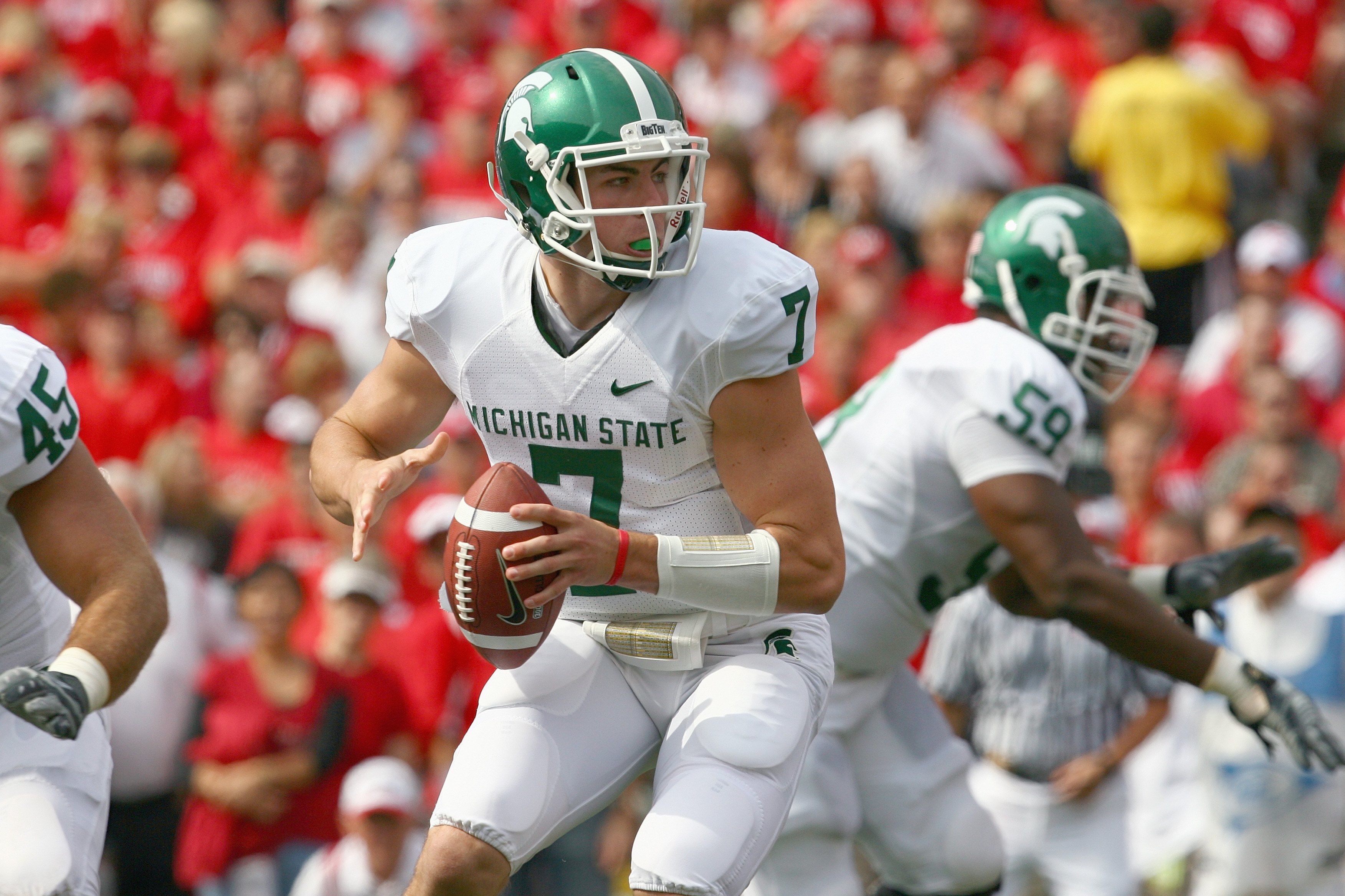 MADISON, WI - SEPTEMBER 26: Keith Nichol #7 of the Michigan State Spartans looks to move the ball against the Wisconsin Badgers on September 26, 2009 at Camp Randall Stadium in Madison, Wisconsin. (Photo by Jonathan Daniel/Getty Images)