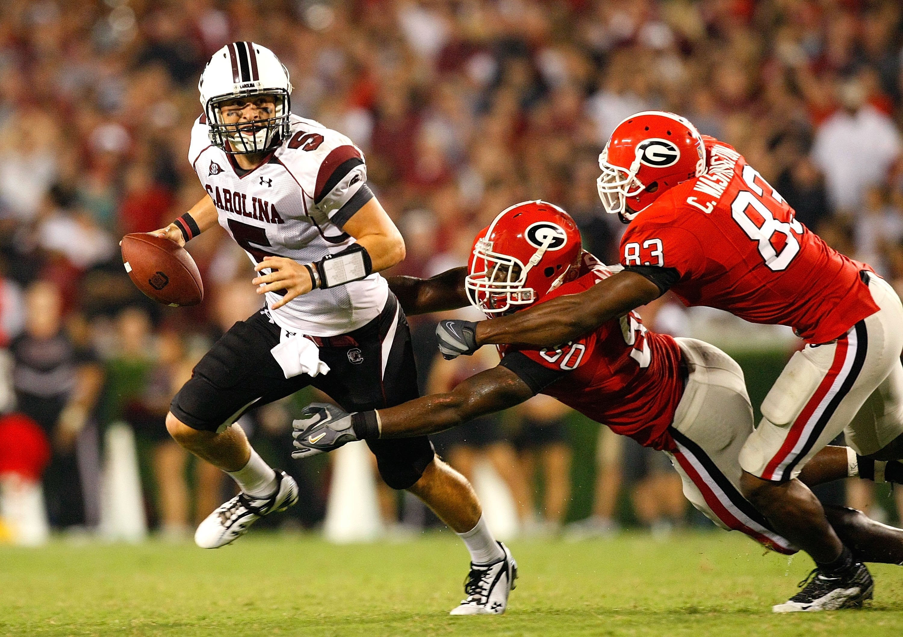 ATHENS, GA - SEPTEMBER 12:  Darryl Gamble #50 and Cornelius Washington #83 of the Georgia Bulldogs sack quarterback Stephen Garcia #5 of the South Carolina Gamecocks at Sanford Stadium on September 12, 2009 in Athens, Georgia.  (Photo by Kevin C. Cox/Gett