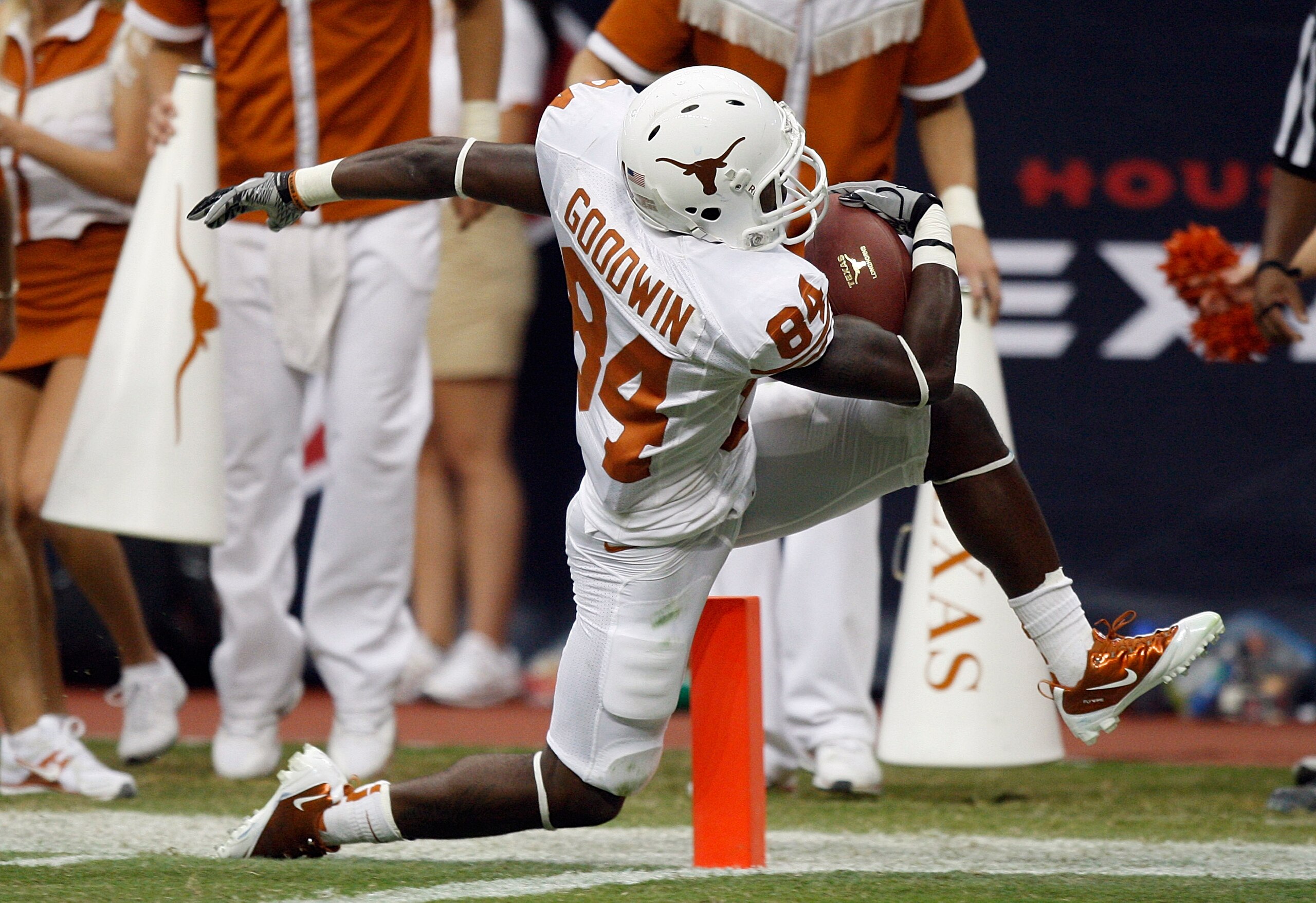 HOUSTON - SEPTEMBER 04:  Wide receiver Marquise Goodwin #84 of the Texas Longhorns steps out of bounds at the two yard line before getting into the endzone during a football game against the Rice Owls at Reliant Stadium on September 4, 2010 in Houston, Te