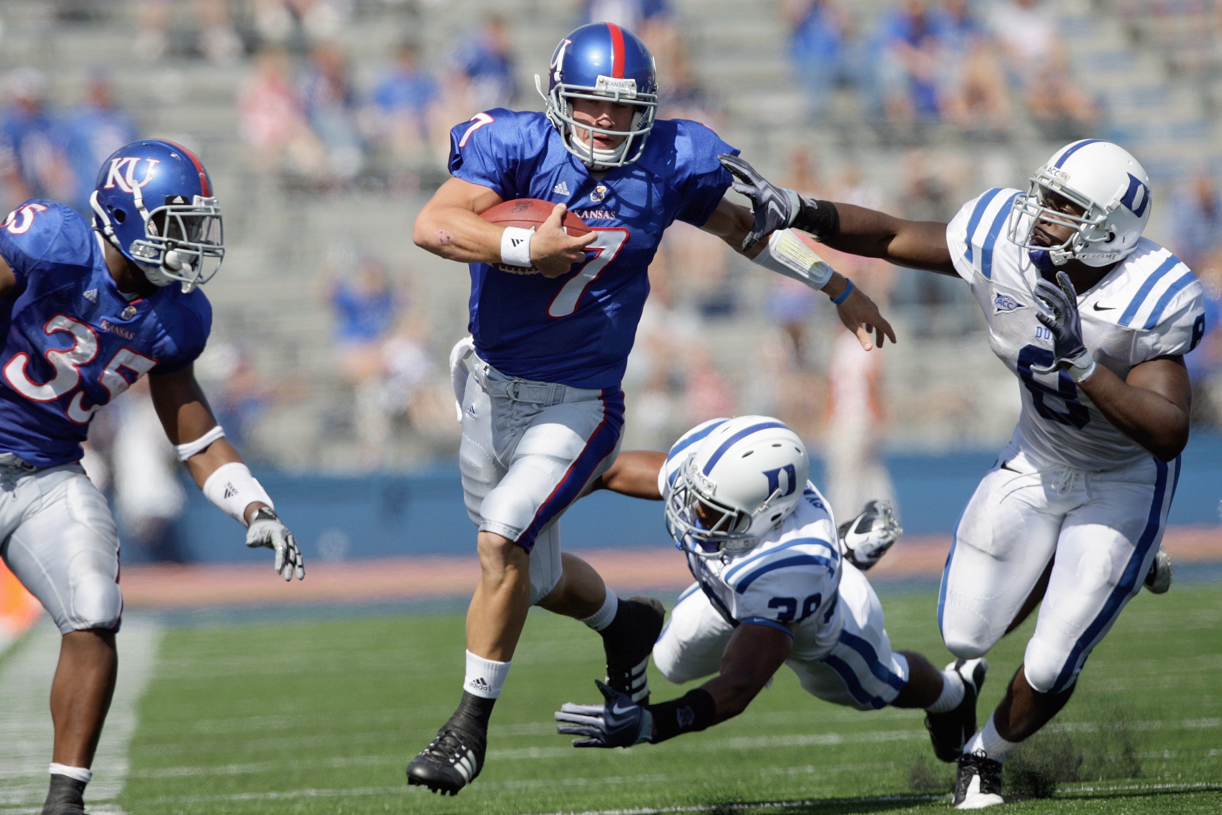 LAWRENCE, KS - SEPTEMBER 19:  Quarterback Kale Pick #7 of the Kansas Jayhawks carries the ball during the game against the Duke Blue Devils on Kivisto Field at Memorial Stadium on September 19, 2009 in Lawrence, Kansas. (Photo by Jamie Squire/Getty Images