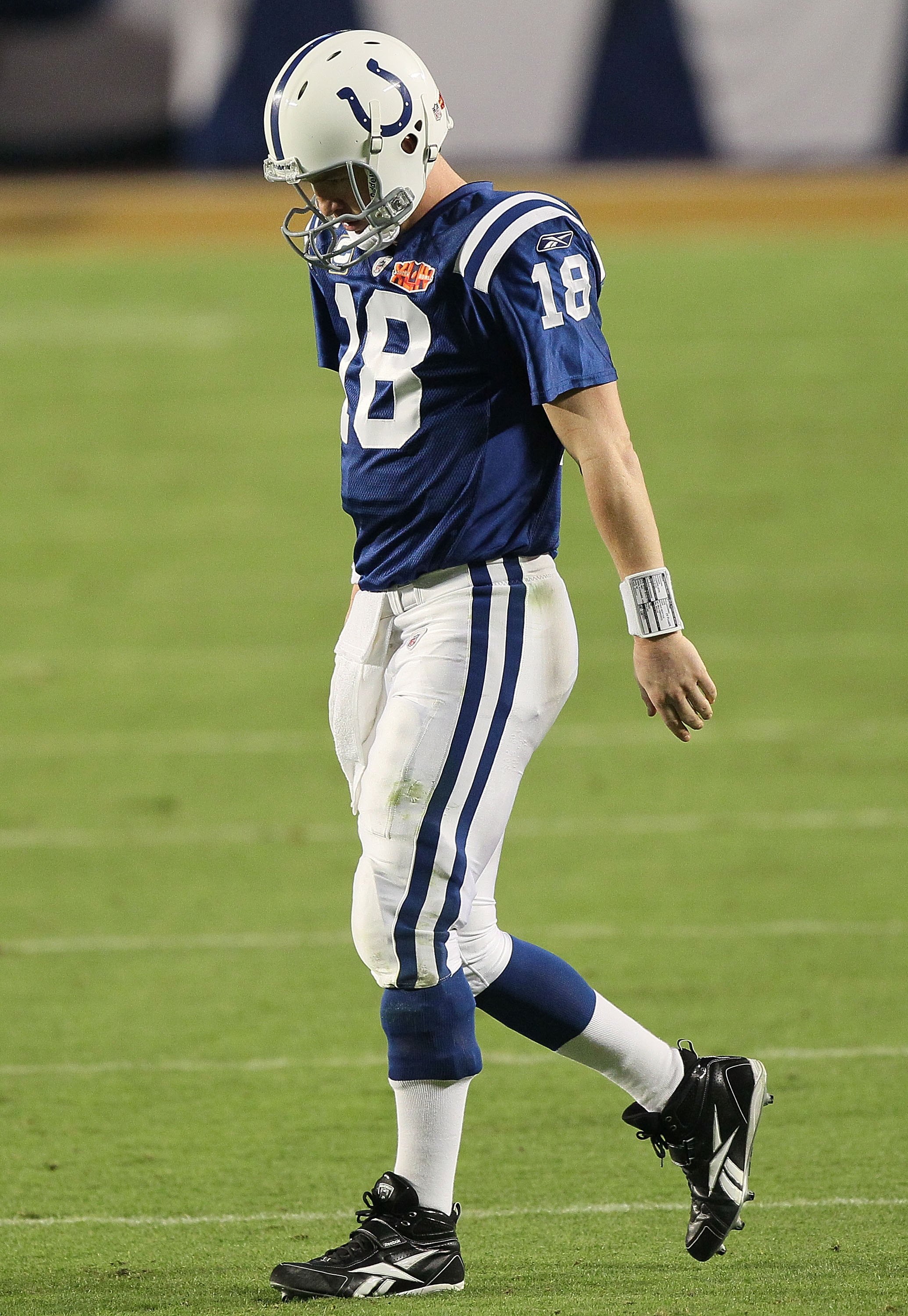 MIAMI GARDENS, FL - FEBRUARY 07:  Peyton Manning #18 of the Indianapolis Colts walks on the field against the New Orleans Saints during Super Bowl XLIV on February 7, 2010 at Sun Life Stadium in Miami Gardens, Florida.  (Photo by Jed Jacobsohn/Getty Image