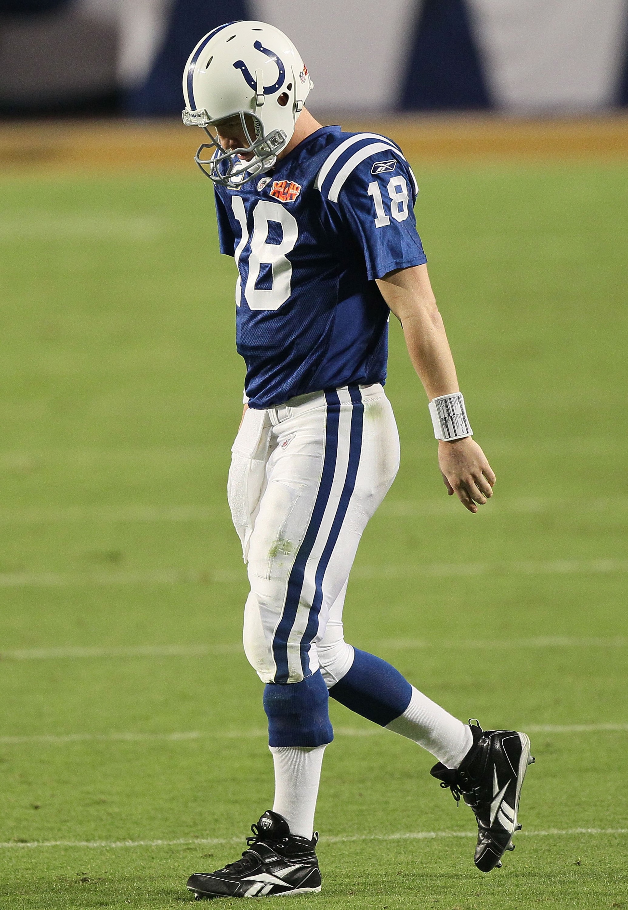 MIAMI GARDENS, FL - FEBRUARY 07:  Peyton Manning #18 of the Indianapolis Colts walks on the field against the New Orleans Saints during Super Bowl XLIV on February 7, 2010 at Sun Life Stadium in Miami Gardens, Florida.  (Photo by Jed Jacobsohn/Getty Image