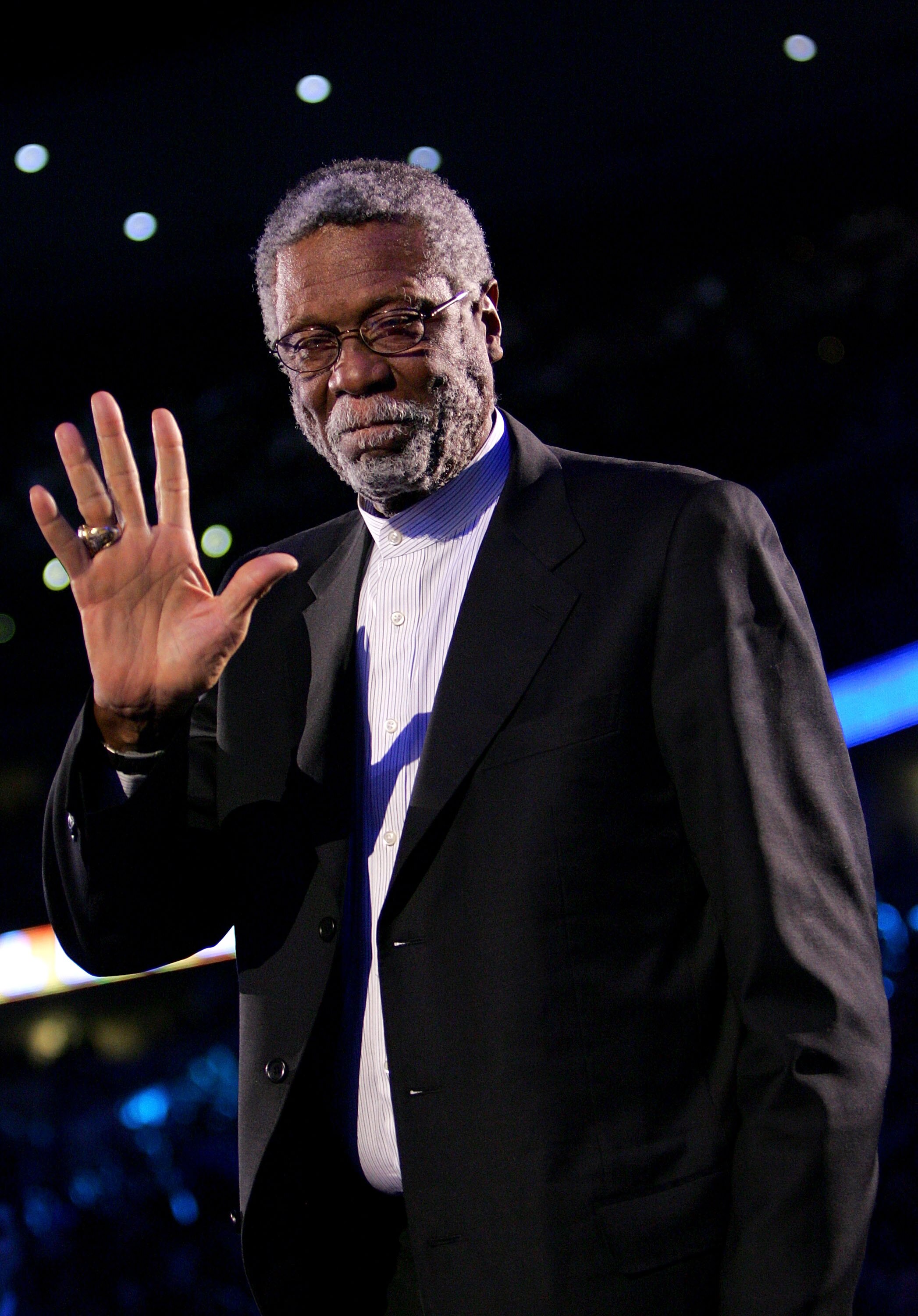 DENVER - FEBRUARY 20:   NBA legend Bill Russell waves to the crowd during the 54th All-Star Game, part of 2005 NBA All-Star Weekend at Pepsi Center on February 20, 2005 in Denver, Colorado.  The East won 125-115.  NOTE TO USER: User expressly acknowledges