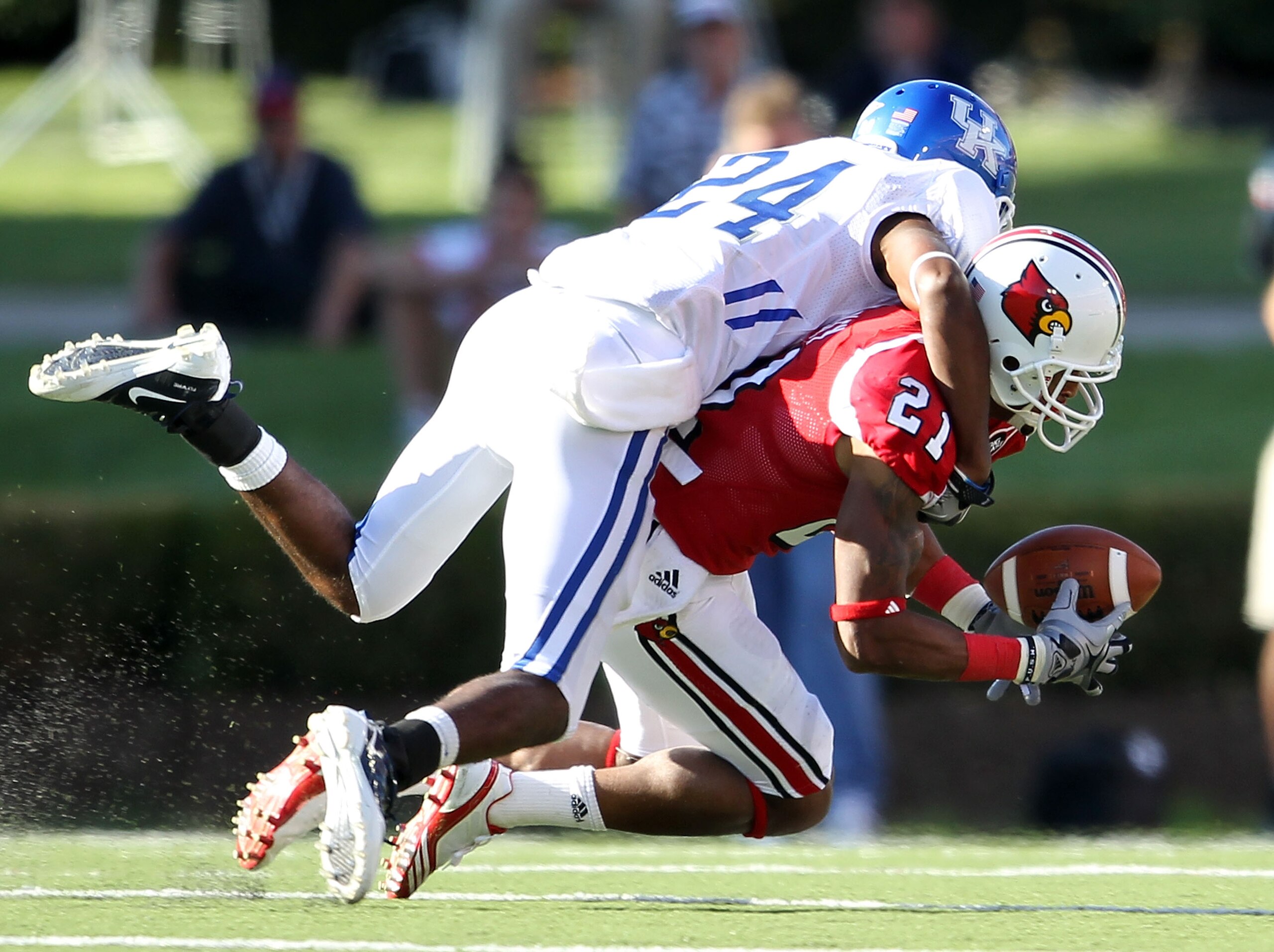 LOUISVILLE, KY - SEPTEMBER 04: Randall Burden #24 of the Kentucky Wildcats breaks up a pass intended for Troy Pascley #21 of the Louisville Cardinals during the game at Papa John's Cardinal Stadium on September 4, 2010 in Louisville, Kentucky.  (Photo by 