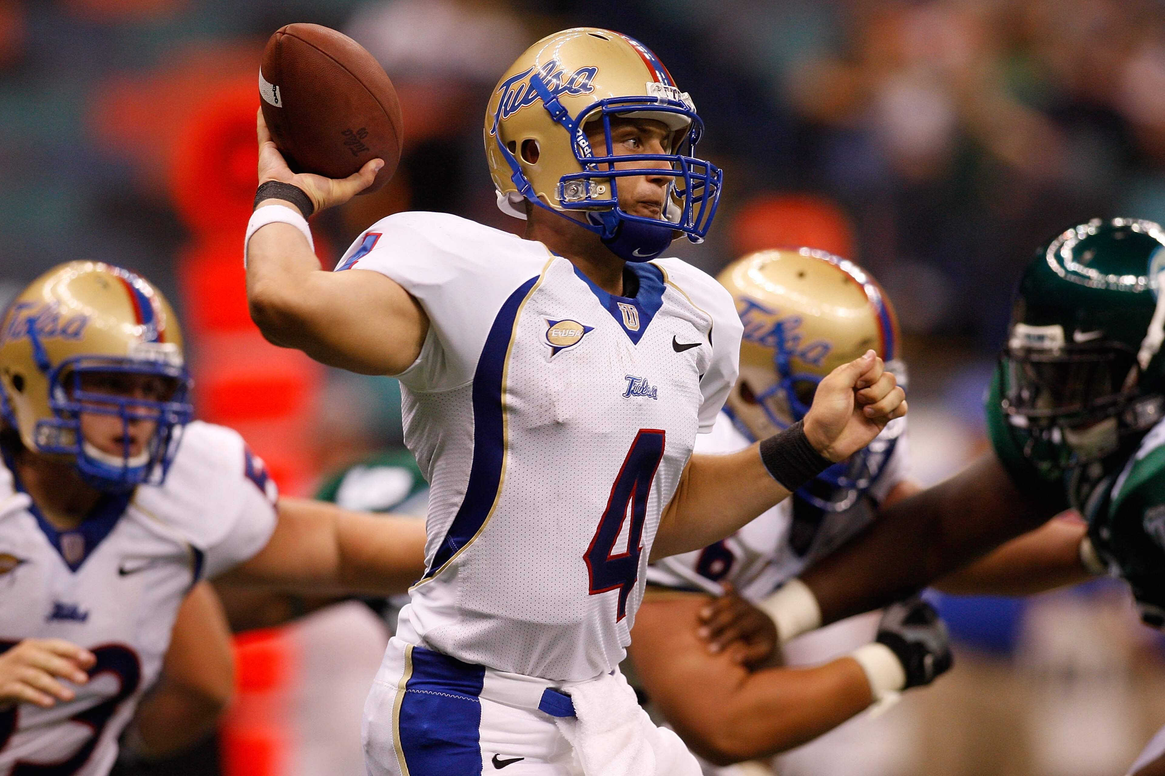 NEW ORLEANS - SEPTEMBER 04: Quarterback G.J. Kinne #4 of the Tulsa Golden Hurricanes throws a pass against the Tulane Green Wave at the Louisiana Superdome on September 4, 2009 in New Orleans, Louisiana. The Hurricanes defeated the Green Wave 37-13. ( NEW ORLEANS - SEPTEMBER 04: Quarterback G.J. Kinne #4 of the Tulsa Golden Hurricanes throws a pass against the Tulane Green Wave at the Louisiana Superdome on September 4, 2009 in New Orleans, Louisiana. The Hurricanes defeated the Green Wave 37-13. (