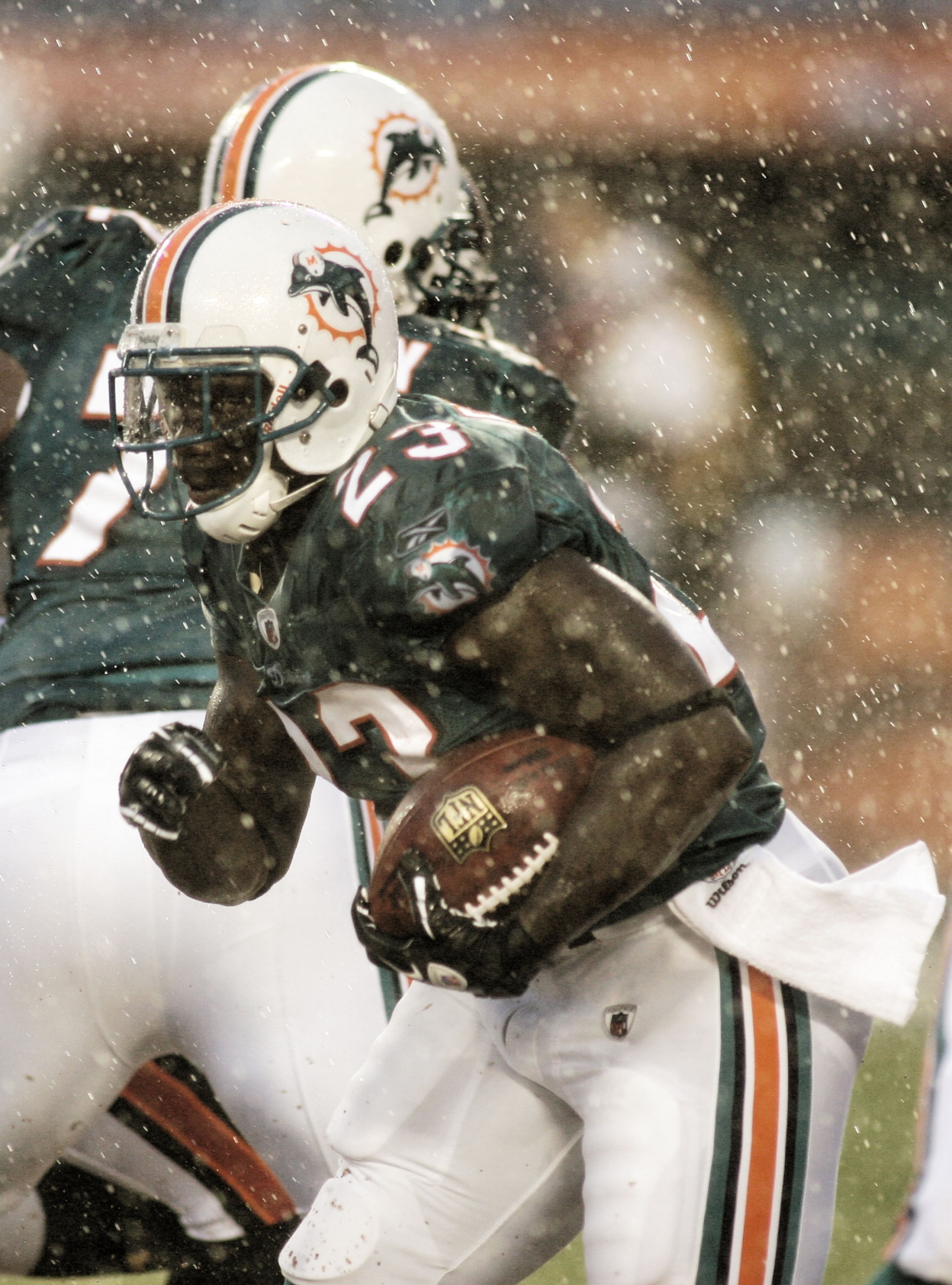 MIAMI - AUGUST 14:  Running back Ronnie Brown #23 rushes the ball in heavy rain against  the Tampa Bay Buccaneers during the preseason game at Sun Life Stadium on August 14, 2010 in Miami, Florida.  (Photo by Marc Serota/Getty Images)