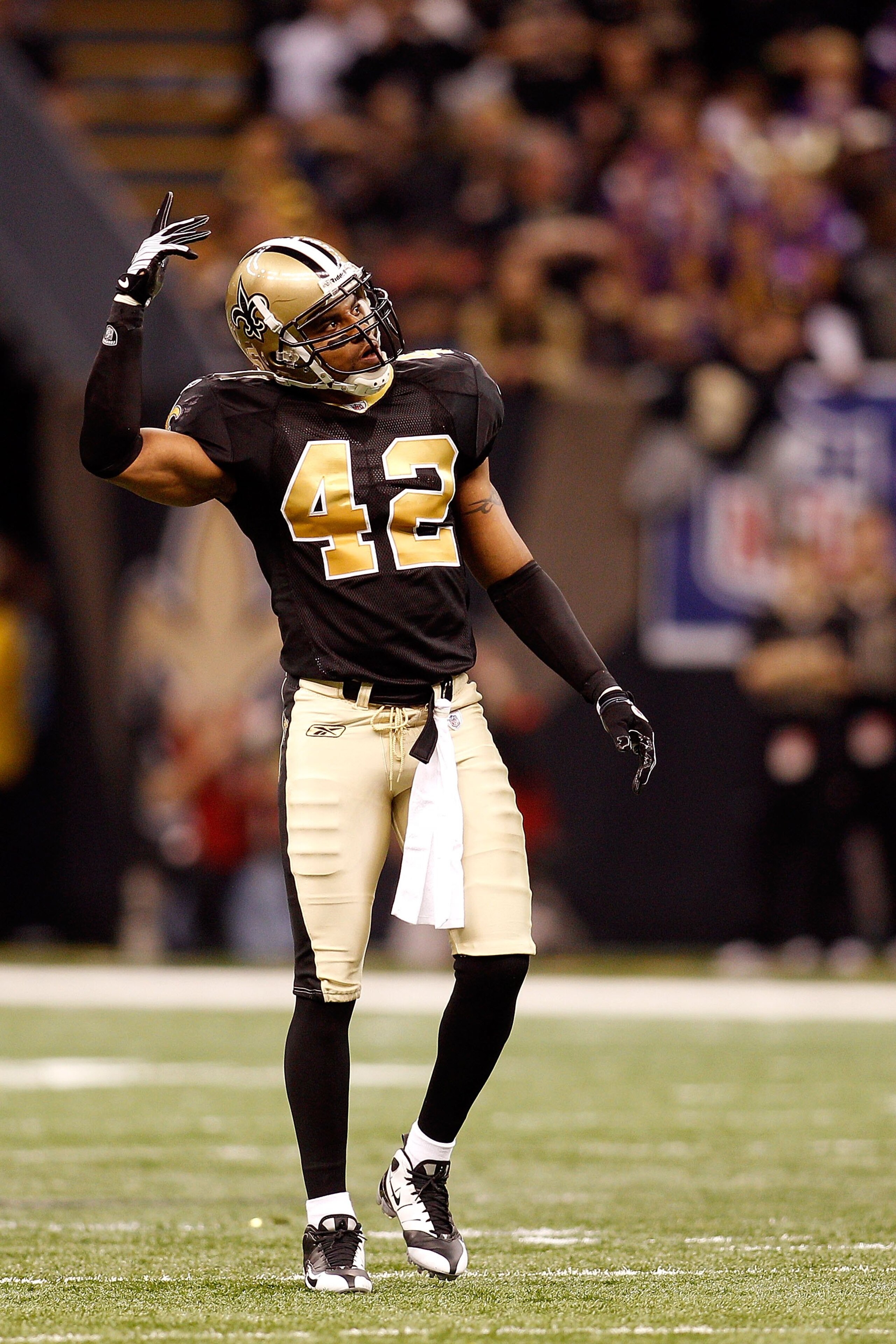 NEW ORLEANS - JANUARY 24:  Darren Sharper #42 of the New Orleans Saints gestures as he stands on the field against the Minnesota Vikings during the NFC Championship Game at the Louisana Superdome on January 24, 2010 in New Orleans, Louisiana. The Saints w
