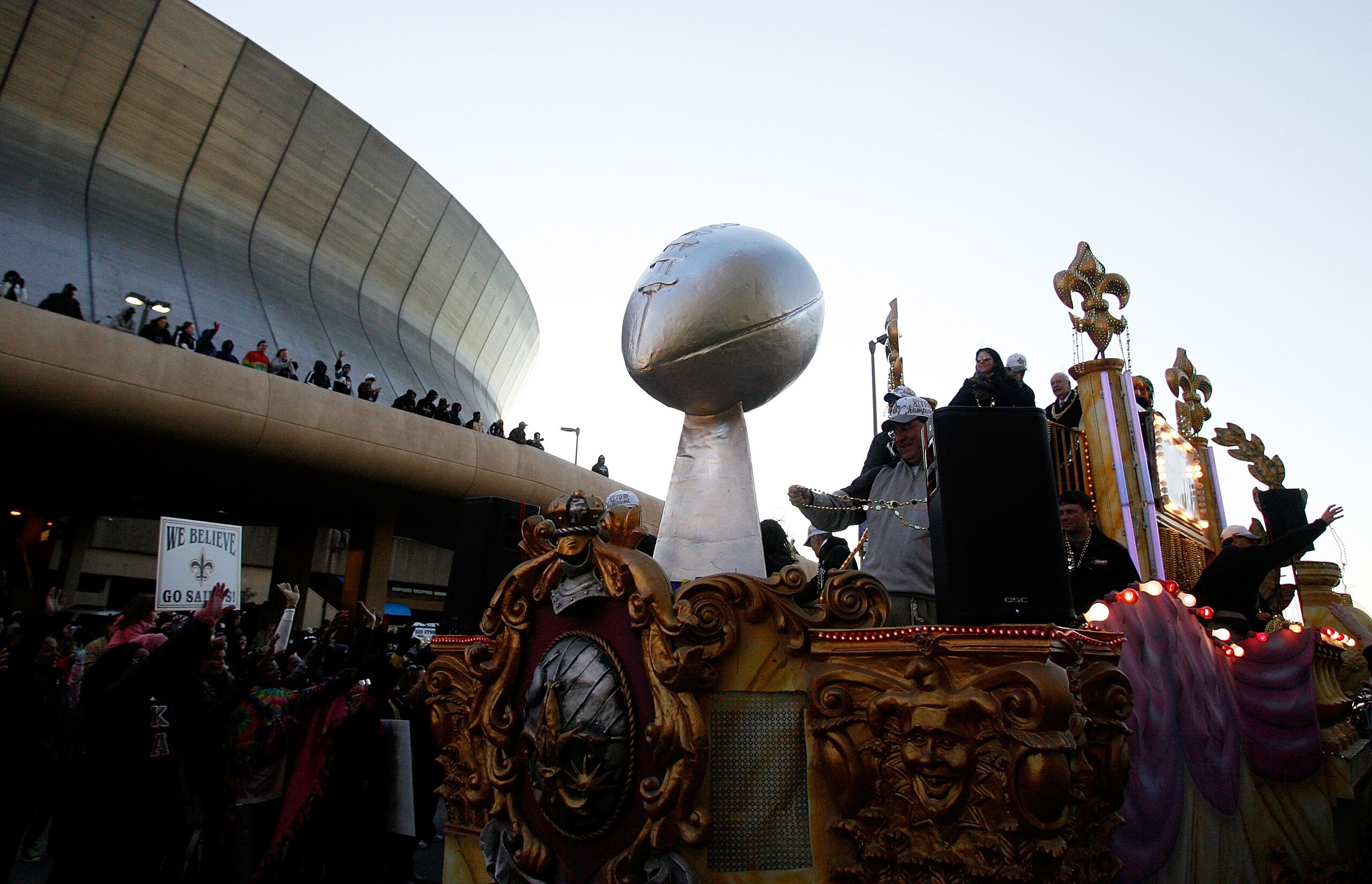 NEW ORLEANS - FEBRUARY 09: New Orleans Saints fans cheer on as their team passes in front of the Louisiana Superdome while parading though the city after winning the Super Bowl XLIV on February 9, 2010 in New Orleans, Louisiana. (Photo by Sean Gardner/Get