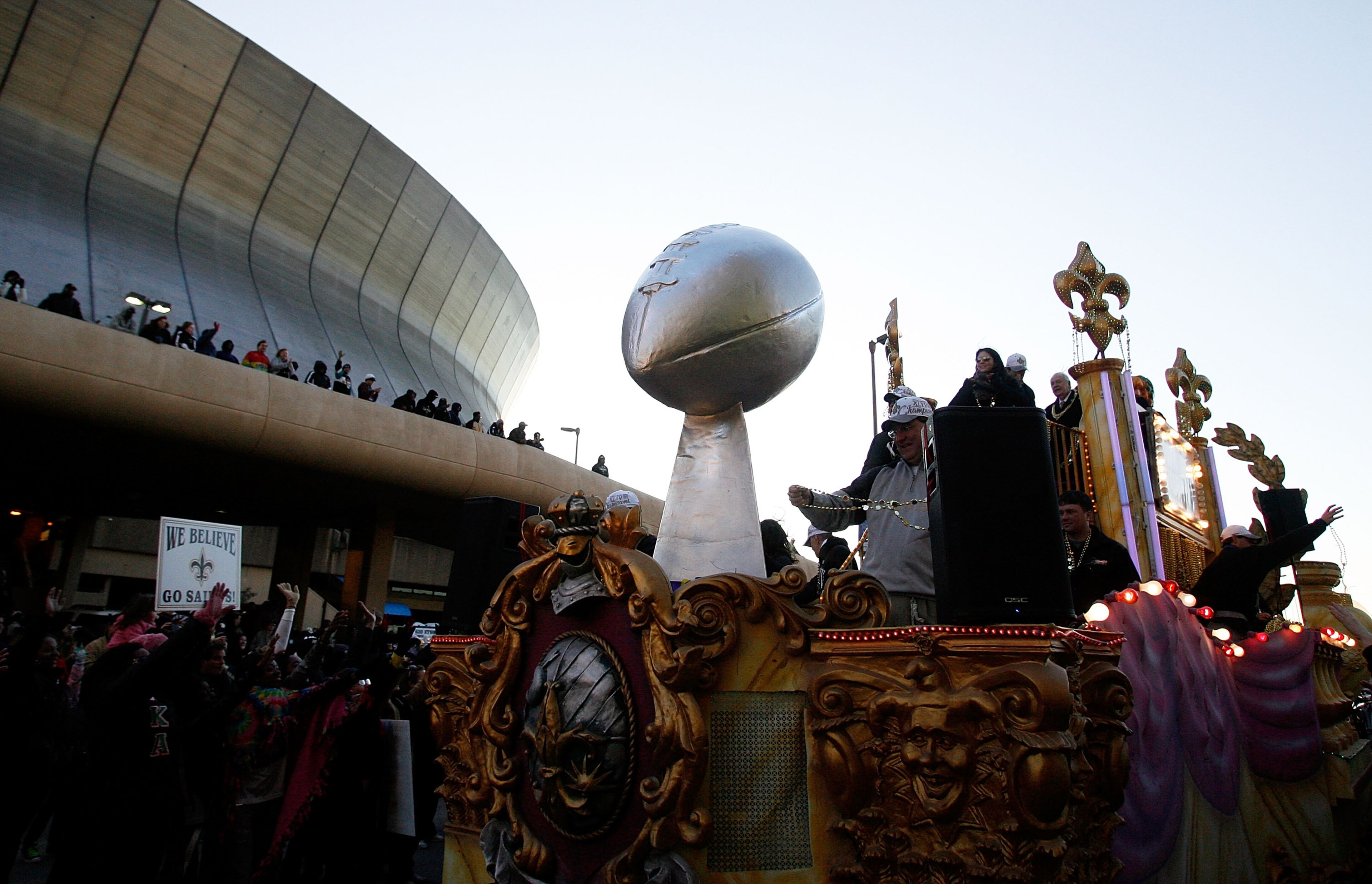 NEW ORLEANS - FEBRUARY 09: New Orleans Saints fans cheer on as their team passes in front of the Louisiana Superdome while parading though the city after winning the Super Bowl XLIV on February 9, 2010 in New Orleans, Louisiana. (Photo by Sean Gardner/Get NEW ORLEANS - FEBRUARY 09: New Orleans Saints fans cheer on as their team passes in front of the Louisiana Superdome while parading though the city after winning the Super Bowl XLIV on February 9, 2010 in New Orleans, Louisiana. (Photo by Sean Gardner/Get