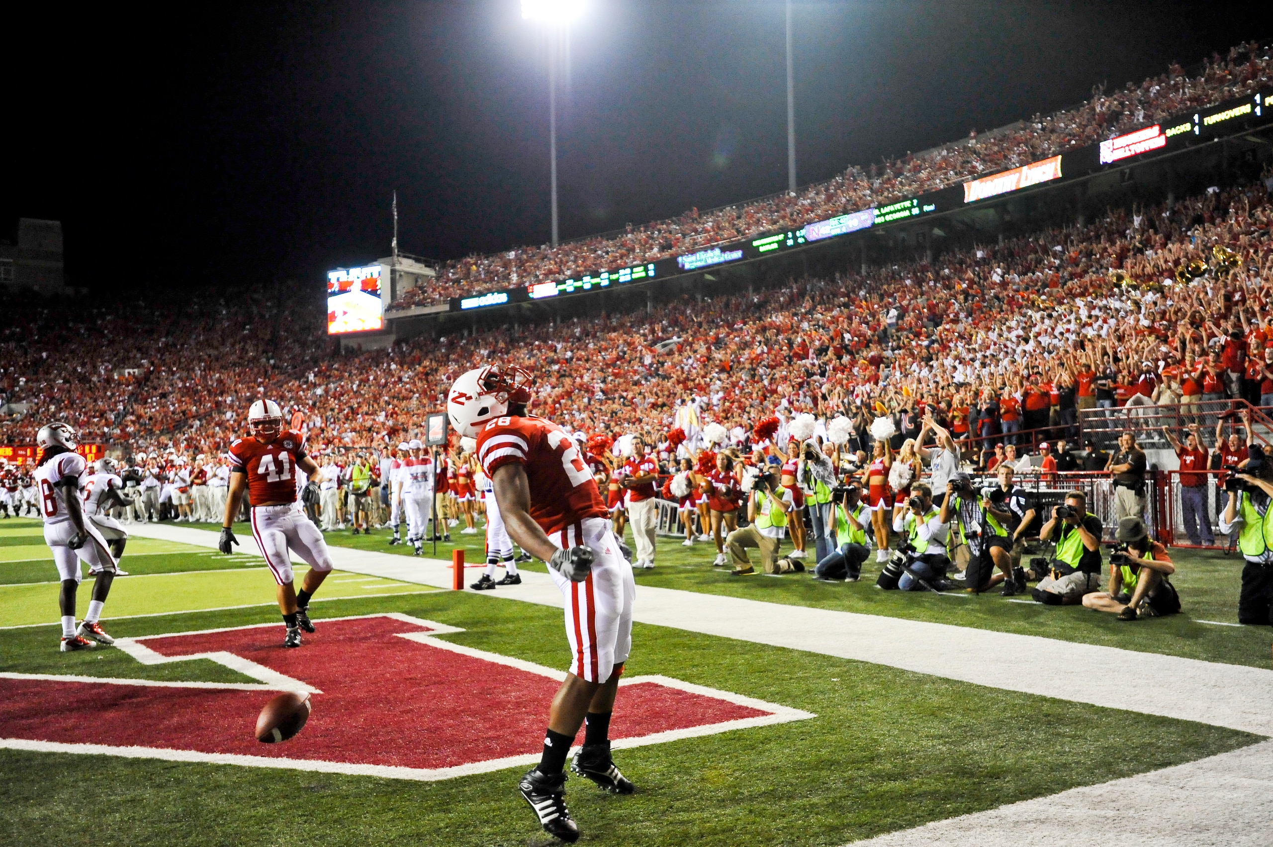 LINCOLN, NE - SEPTEMBER 04: Austin Jones #28 of the Nebraska Cornhuskers  celebrates his first touchdown as a Cornhusker against the Western Kentucky Hilltoppers  during second half action of their game at Memorial Stadium on September 4, 2010 in Lincoln,