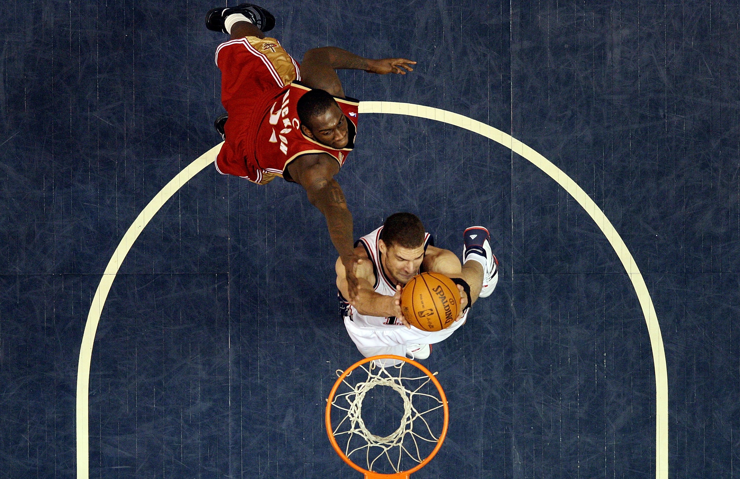 EAST RUTHERFORD, NJ - MARCH 03:  Brook Lopez #11 of the New Jersey Nets goes to the hoop against J.J. Hickson #21 of the Cleveland Cavaliers at the Izod Center on March 3, 2010 in East Rutherford, New Jersey.NOTE TO USER: User expressly acknowledges and a