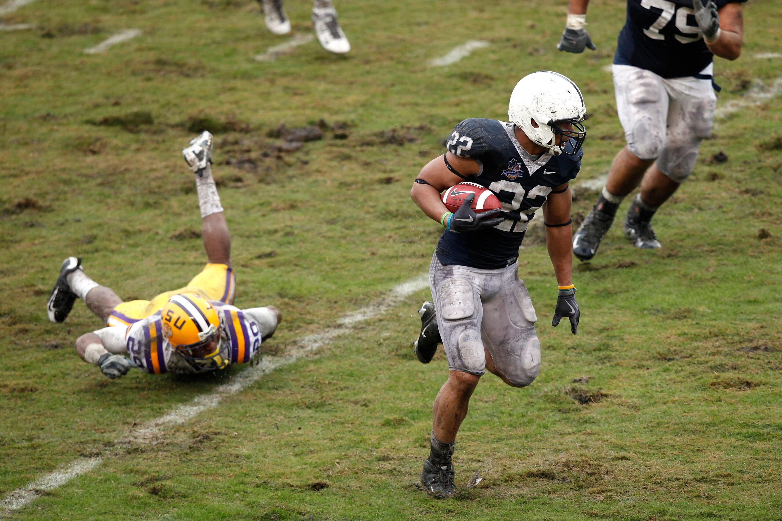 ORLANDO, FL - JANUARY 1: Evan Royster #22 of the Penn State Nittany Lions runs with the football during the 2010 Capital One Bowl against the LSU Tigers at the Florida Citrus Bowl Stadium on January 1, 2010 in Orlando, Florida. Penn State won 19-17. (Phot