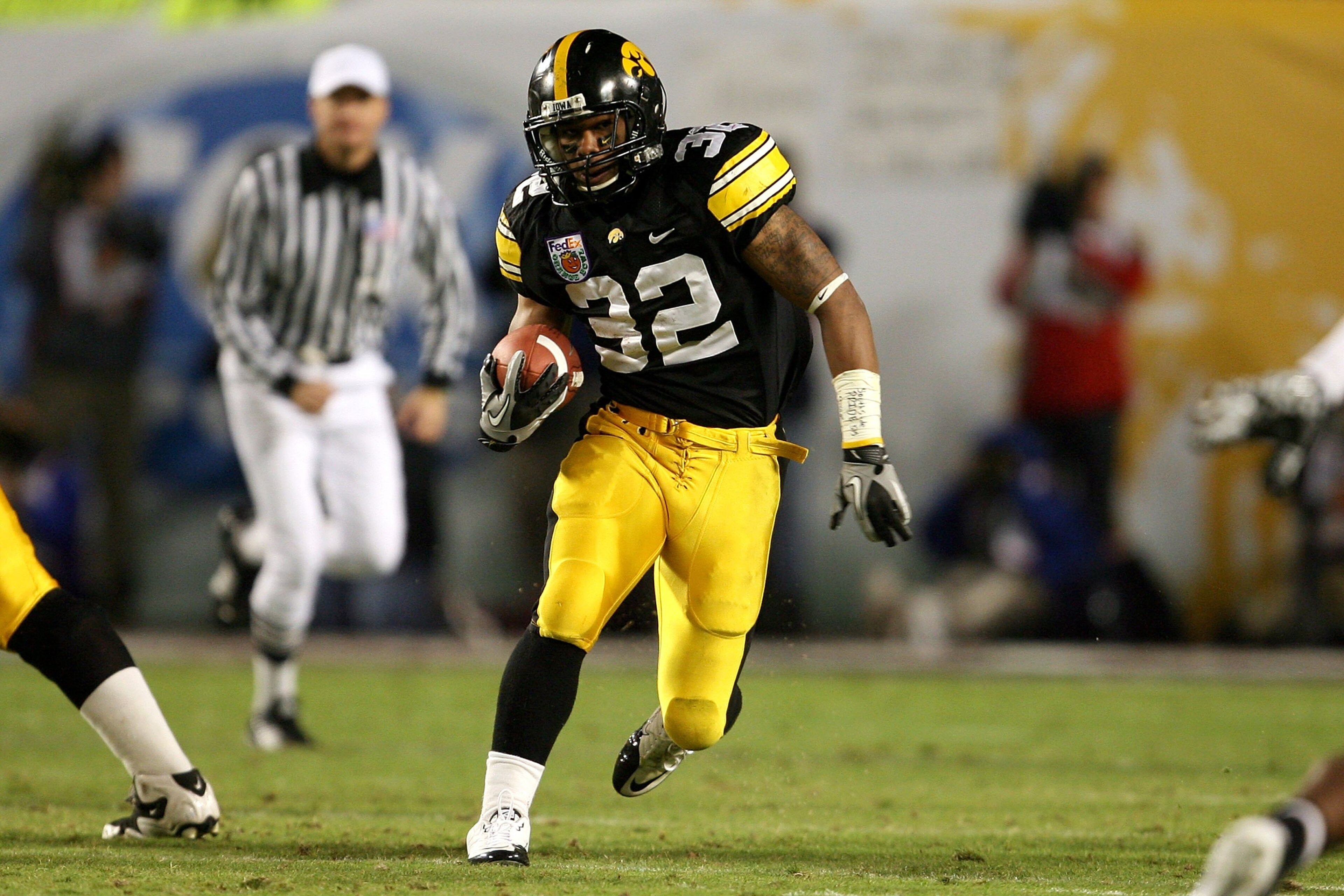 MIAMI GARDENS, FL - JANUARY 05:  Adam Robinson #32 of the Iowa Hawkeyes runs the ball against the Georgia Tech Yellow Jackets during the FedEx Orange Bowl at Land Shark Stadium on January 5, 2010 in Miami Gardens, Florida. Iowa won 24-14.  (Photo by Doug