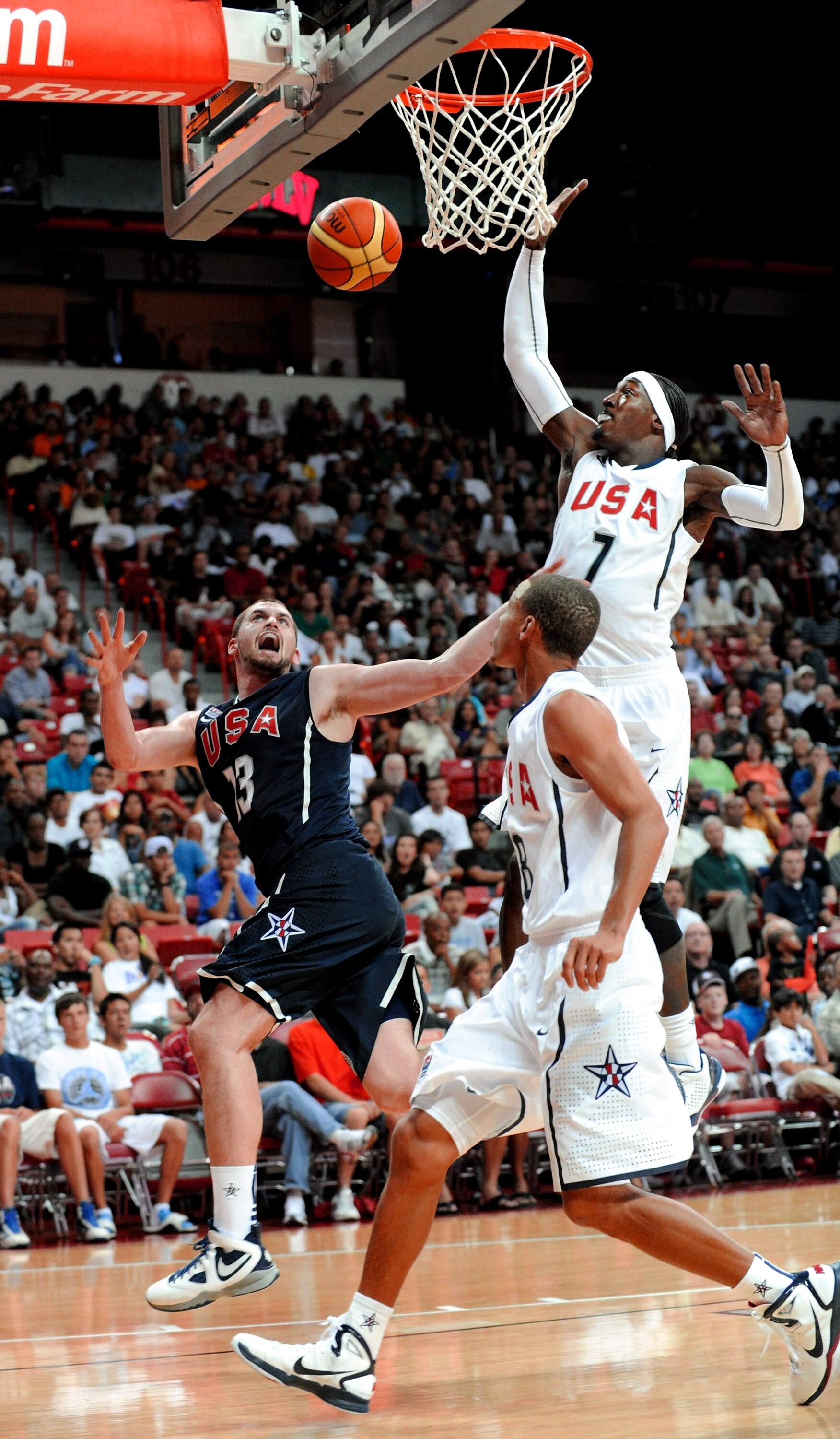 LAS VEGAS - JULY 24:  Kevin Love #13 of the 2010 USA Basketball Men's National Team reacts after being fouled by Stephen Curry #8 of the 2010 USA Basketball Men's National Team as teammate Gerald Wallace #7 trails the play during a USA Basketball showcase