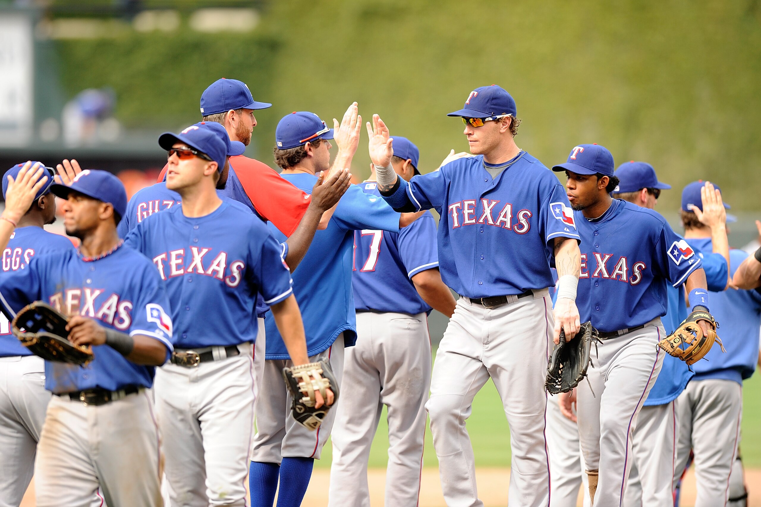 BALTIMORE - AUGUST 22:  Josh Hamilton #32 of the Texas Rangers celebrates with teammates after a 6-4 victory against the Baltimore Orioles at Camden Yards on August 22, 2010 in Baltimore, Maryland.  (Photo by Greg Fiume/Getty Images)
