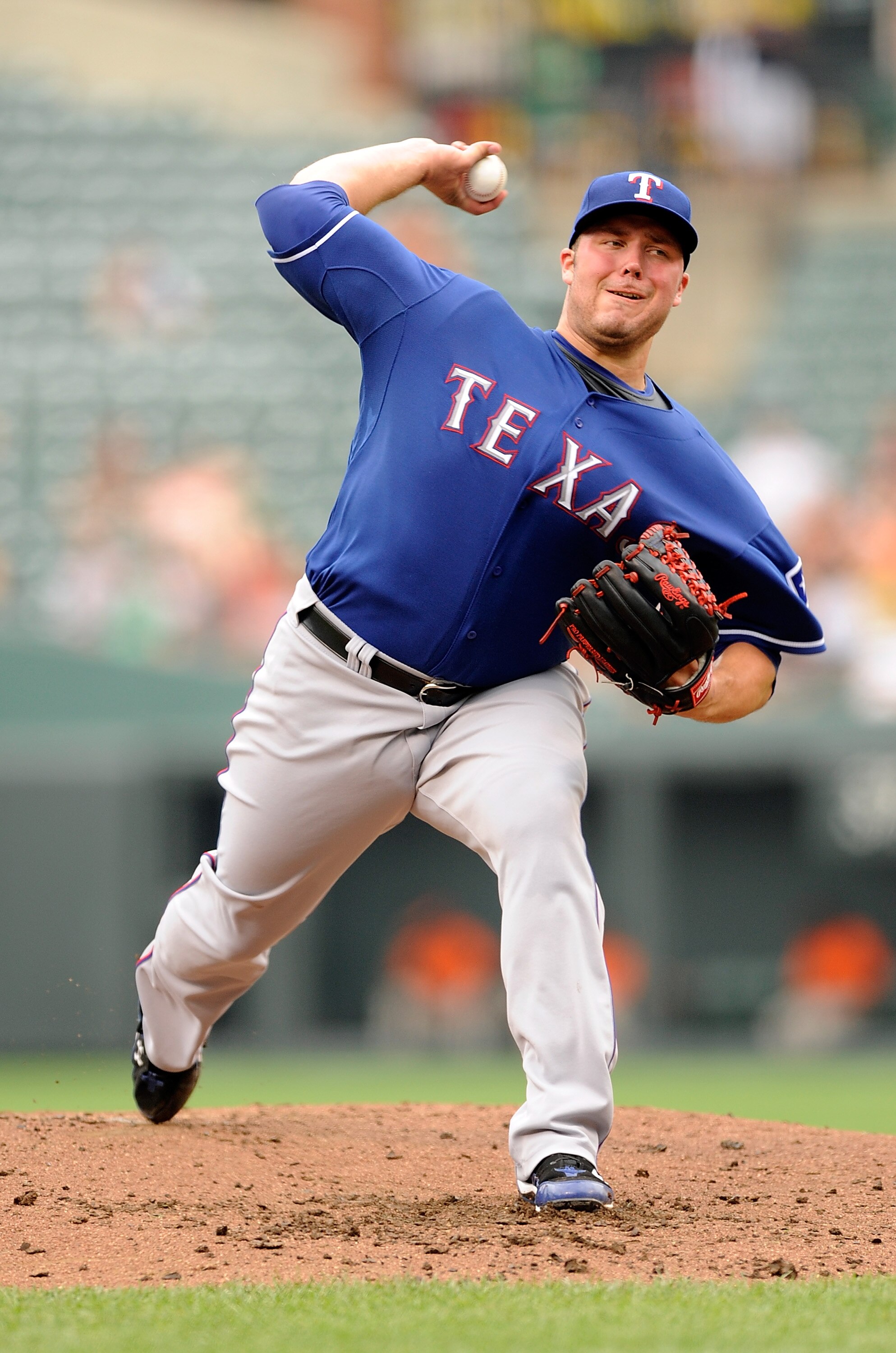 BALTIMORE - AUGUST 22:  Tommy Hunter #35 of the Texas Rangers pitches against the Baltimore Orioles at Camden Yards on August 22, 2010 in Baltimore, Maryland.  (Photo by Greg Fiume/Getty Images)